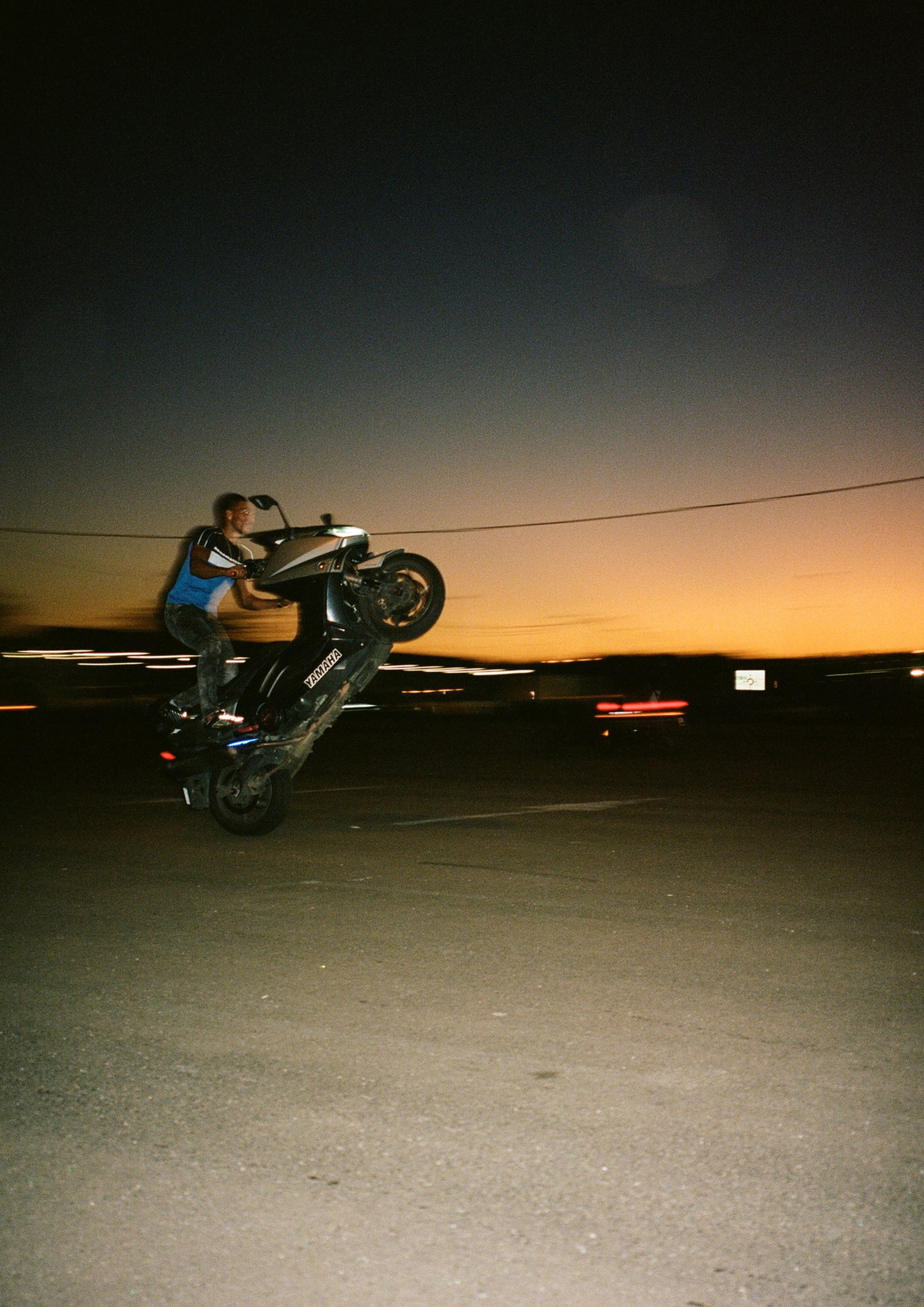 a man riding a motorcyle at night