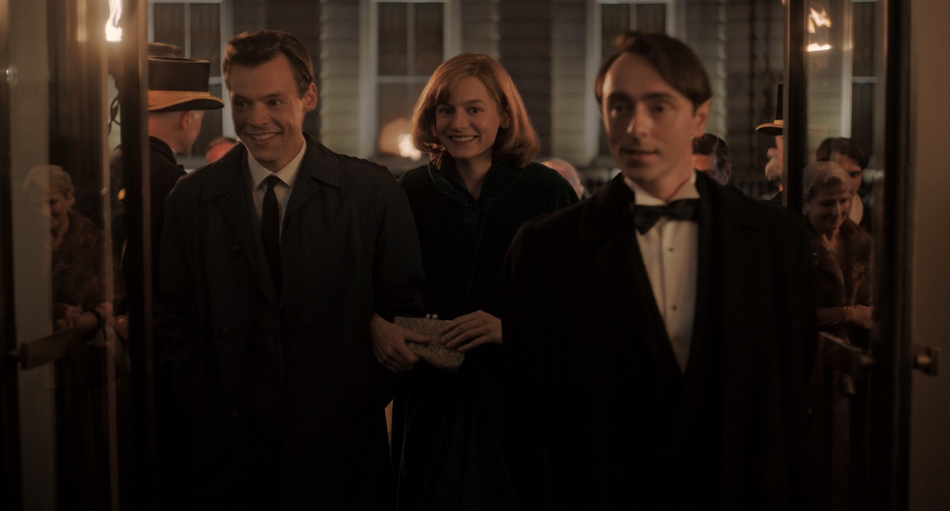 Harry Styles, Emma Corrin and David Dawson as Tom, Marion and Patrick walking into an event in My Policeman