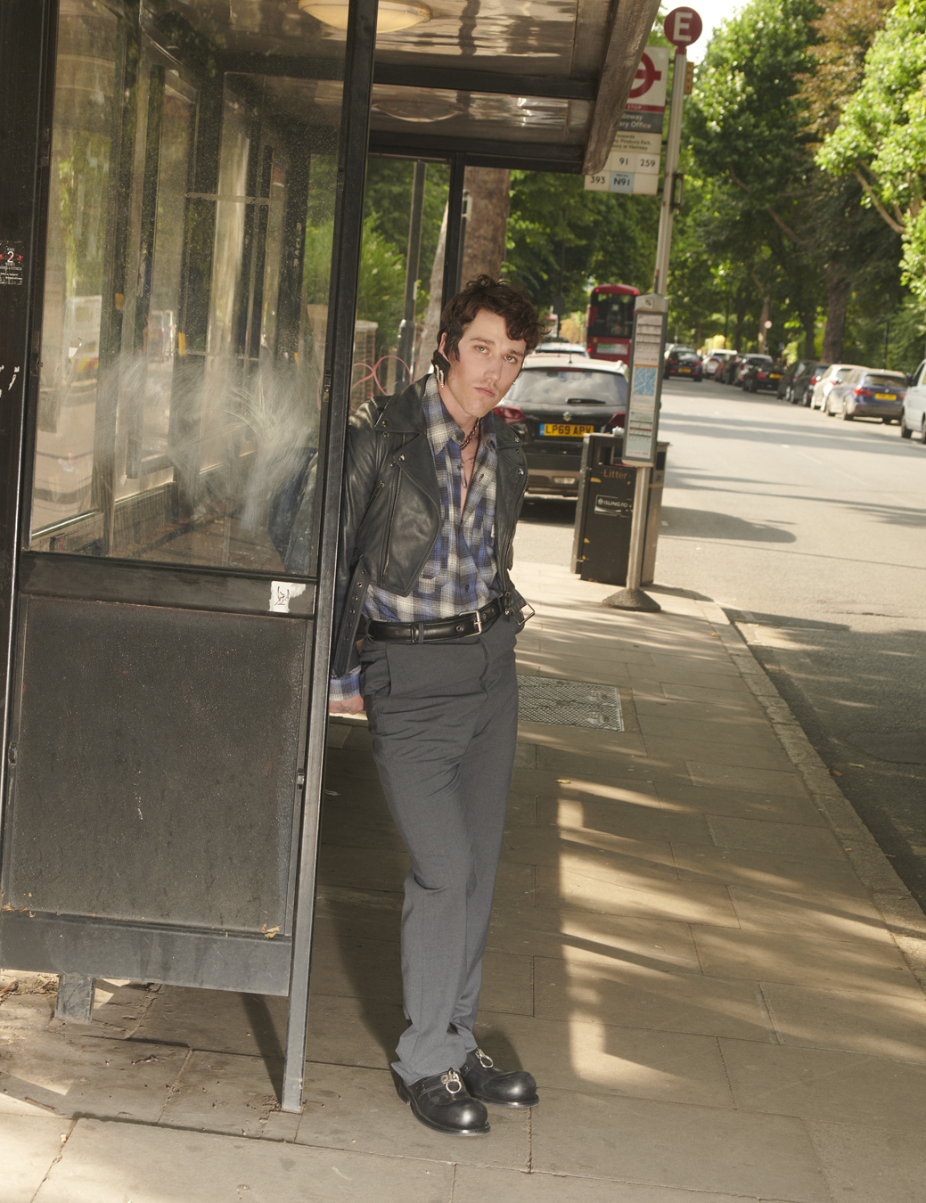 Model at a London bus stop wearing Martine Rose in i-D no.369 The Ultra! Issue, Fall 2022