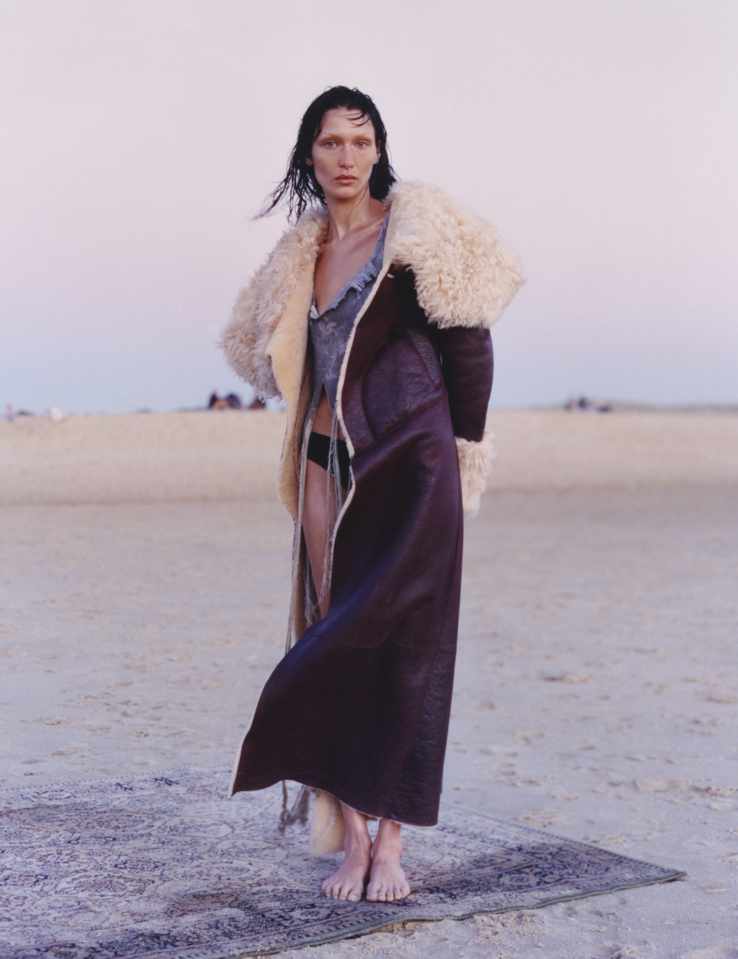 Bella Hadid on the beach with a rug photographed by Sam Rock in i-D No. 369 The Ultra! Issue, Fall 2022