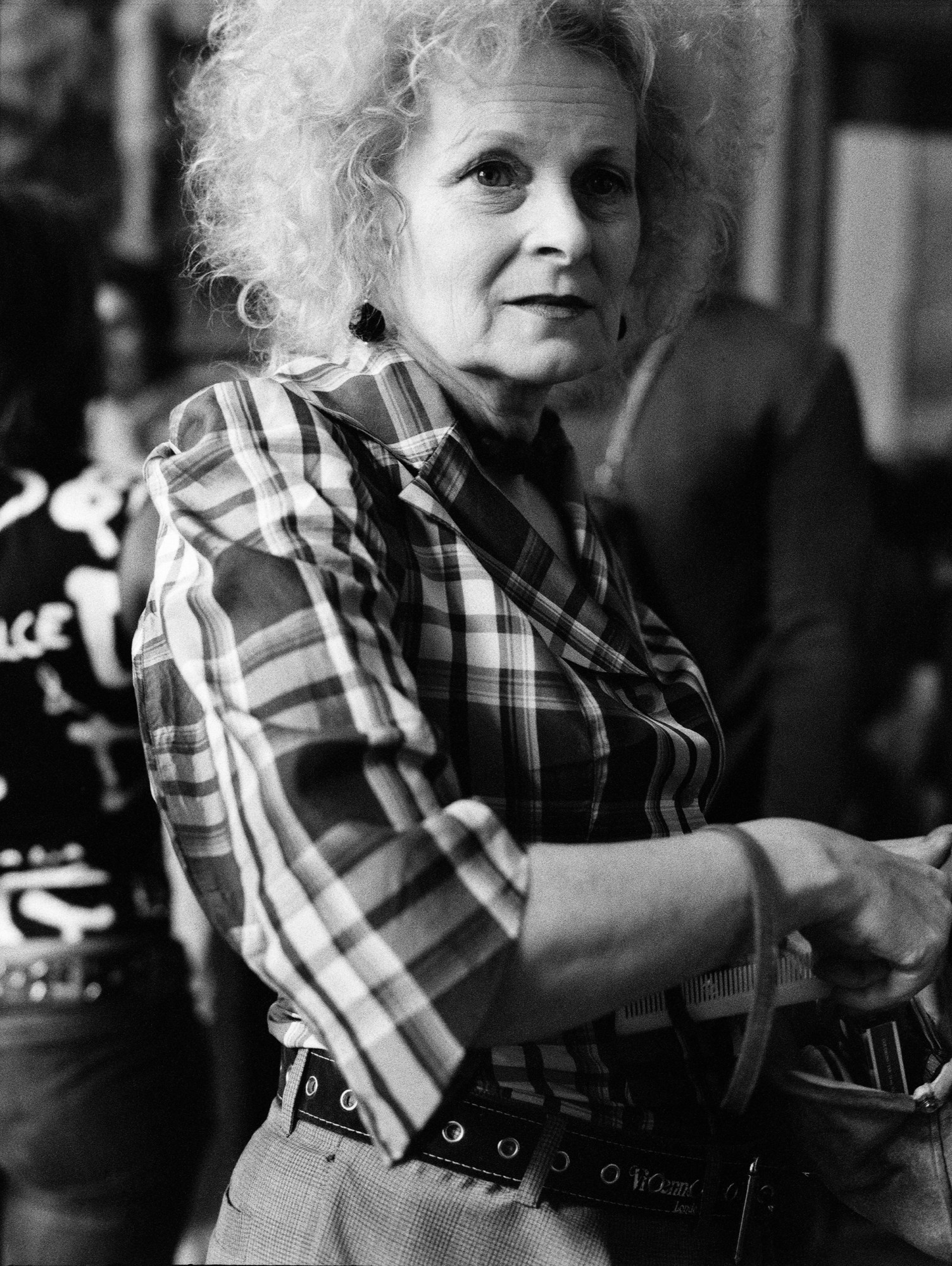 black-and-white image of vivienne westwood backstage at a show in the early 2000s