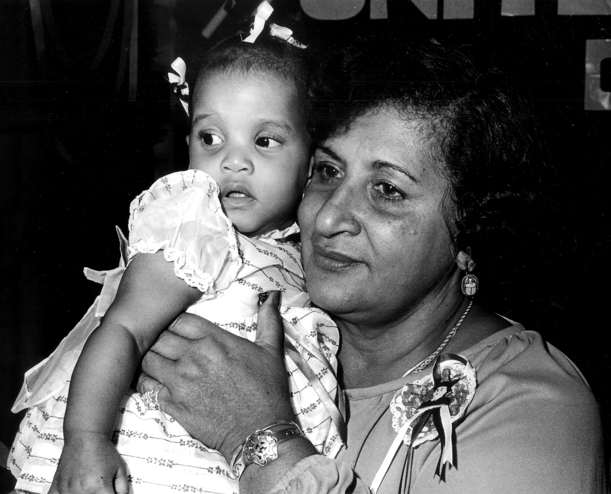 black-and-white photo of Dr. Evelina López Antonetty with her grandchild.