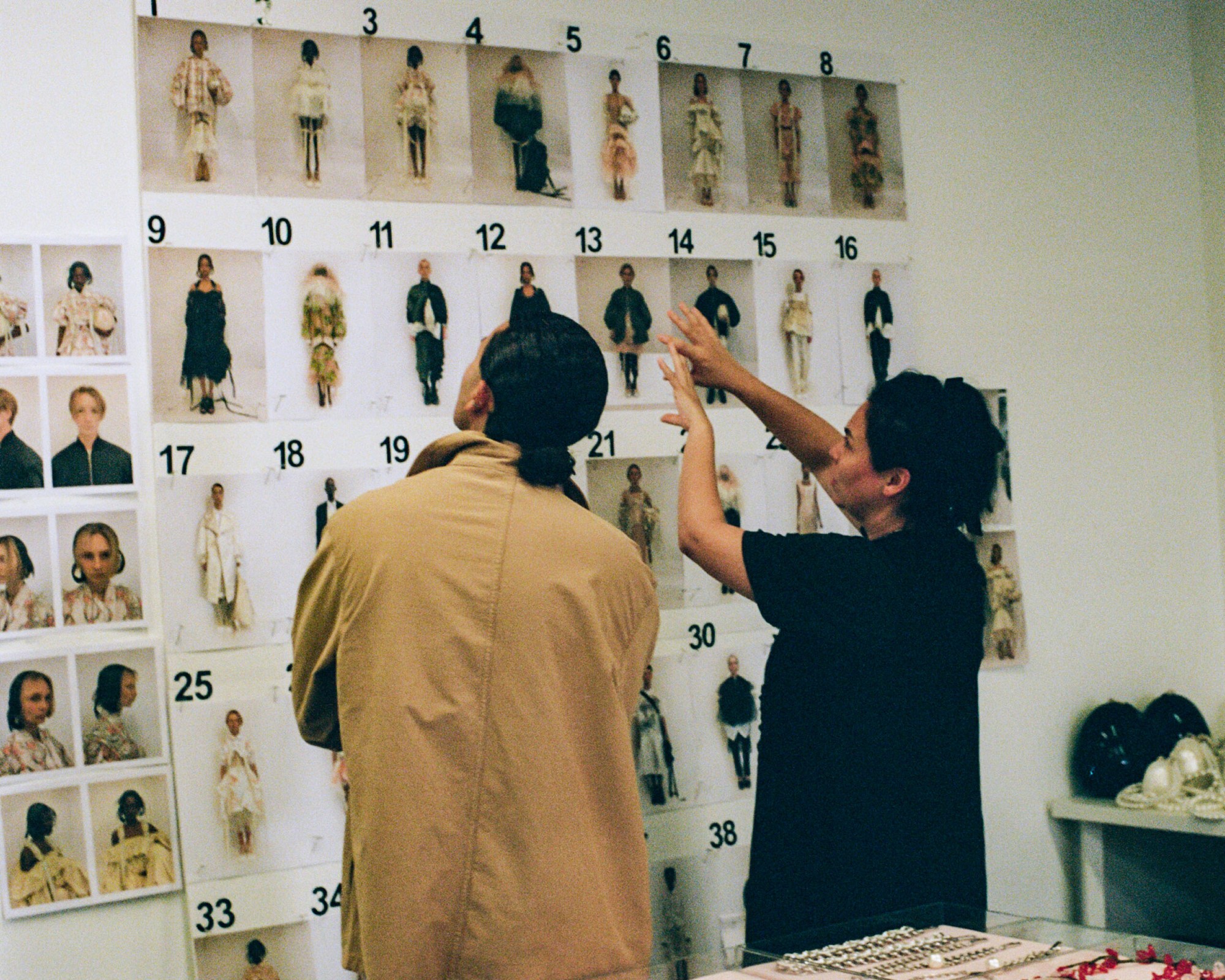 Simone and I-D's Osman behind the scenes at Simone Rocha SS23 at the look wall