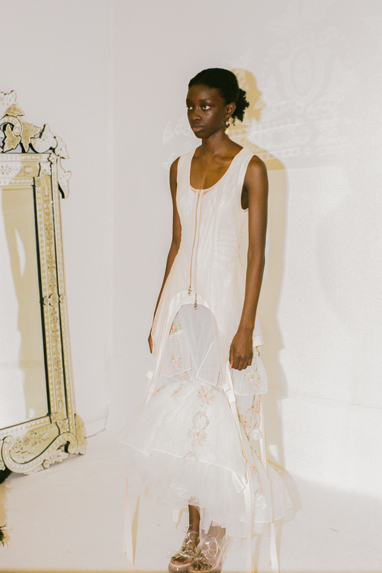 Model behind the scenes as Simone Rocha SS23 in a white dress