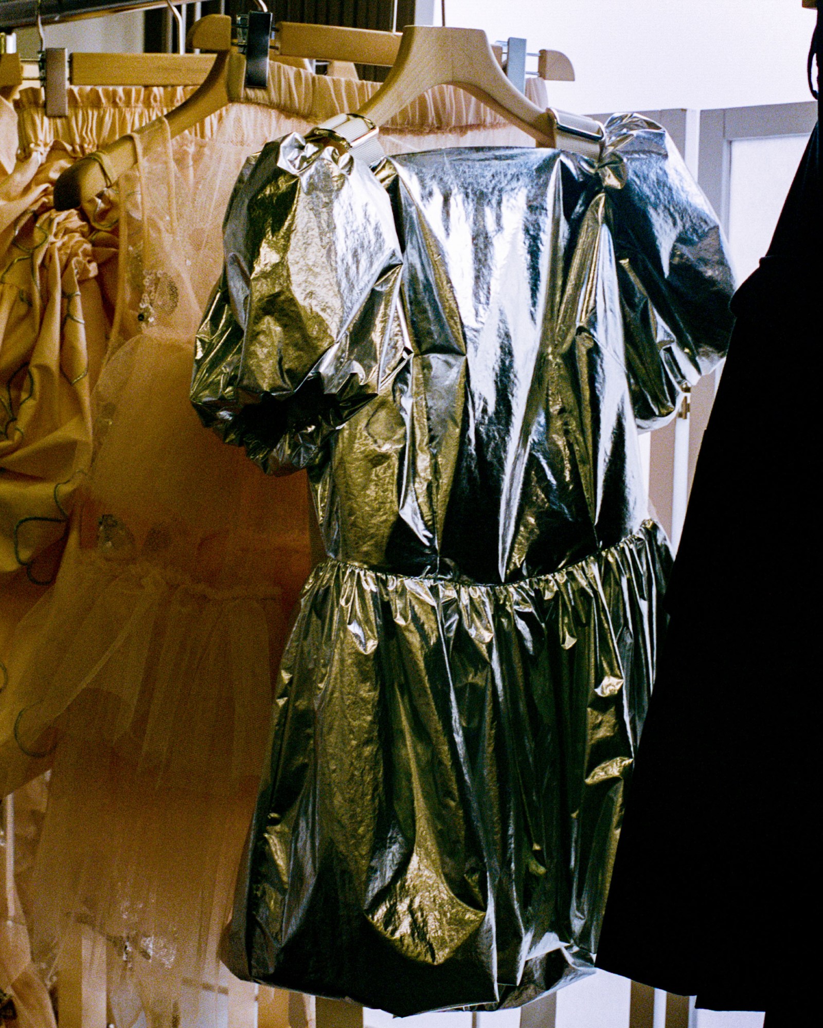 black plastic dress behind the scenes at Simone Rocha SS23