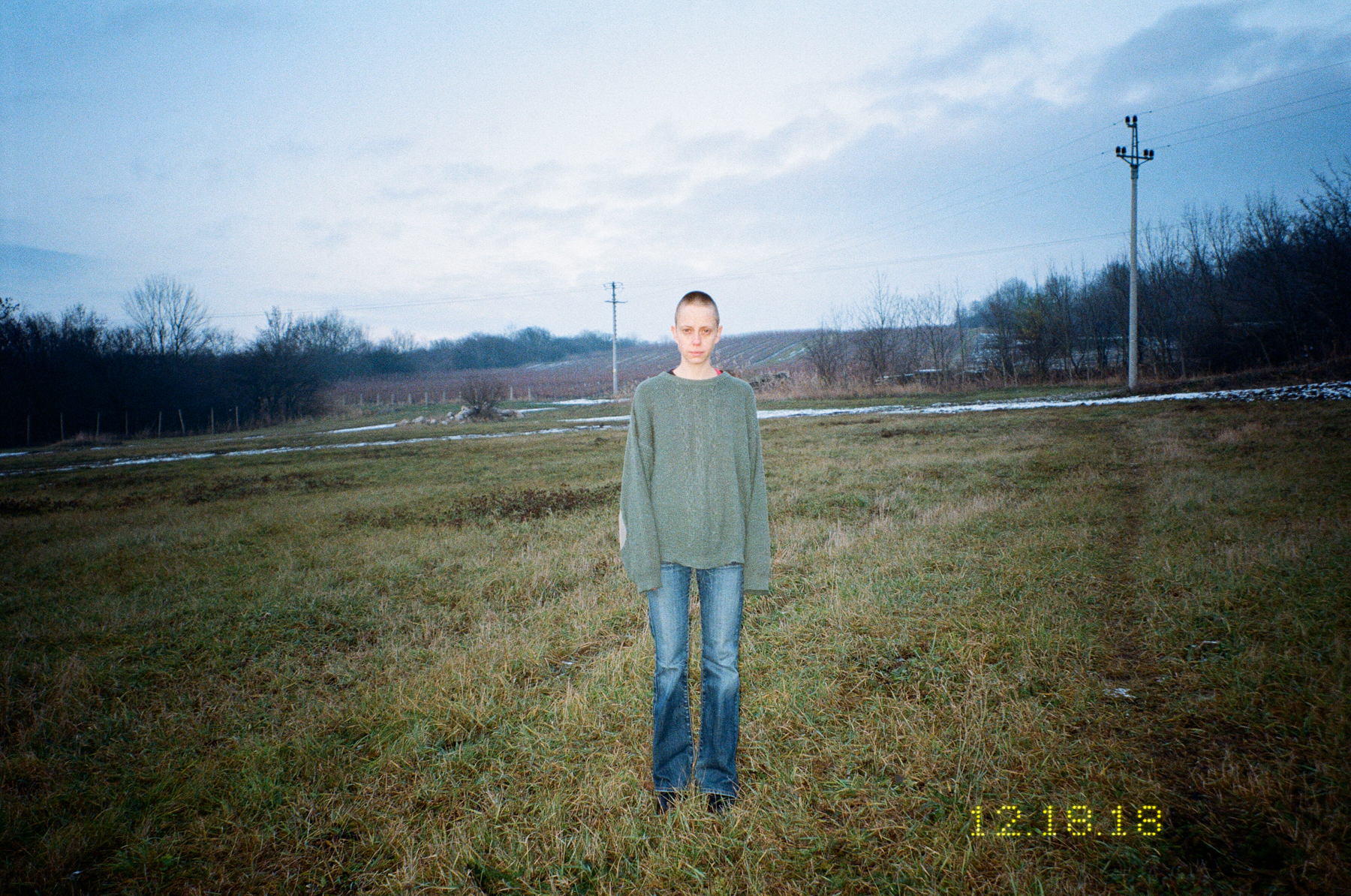 Photograph by Marie Tomanova of herself standing on a football pitch