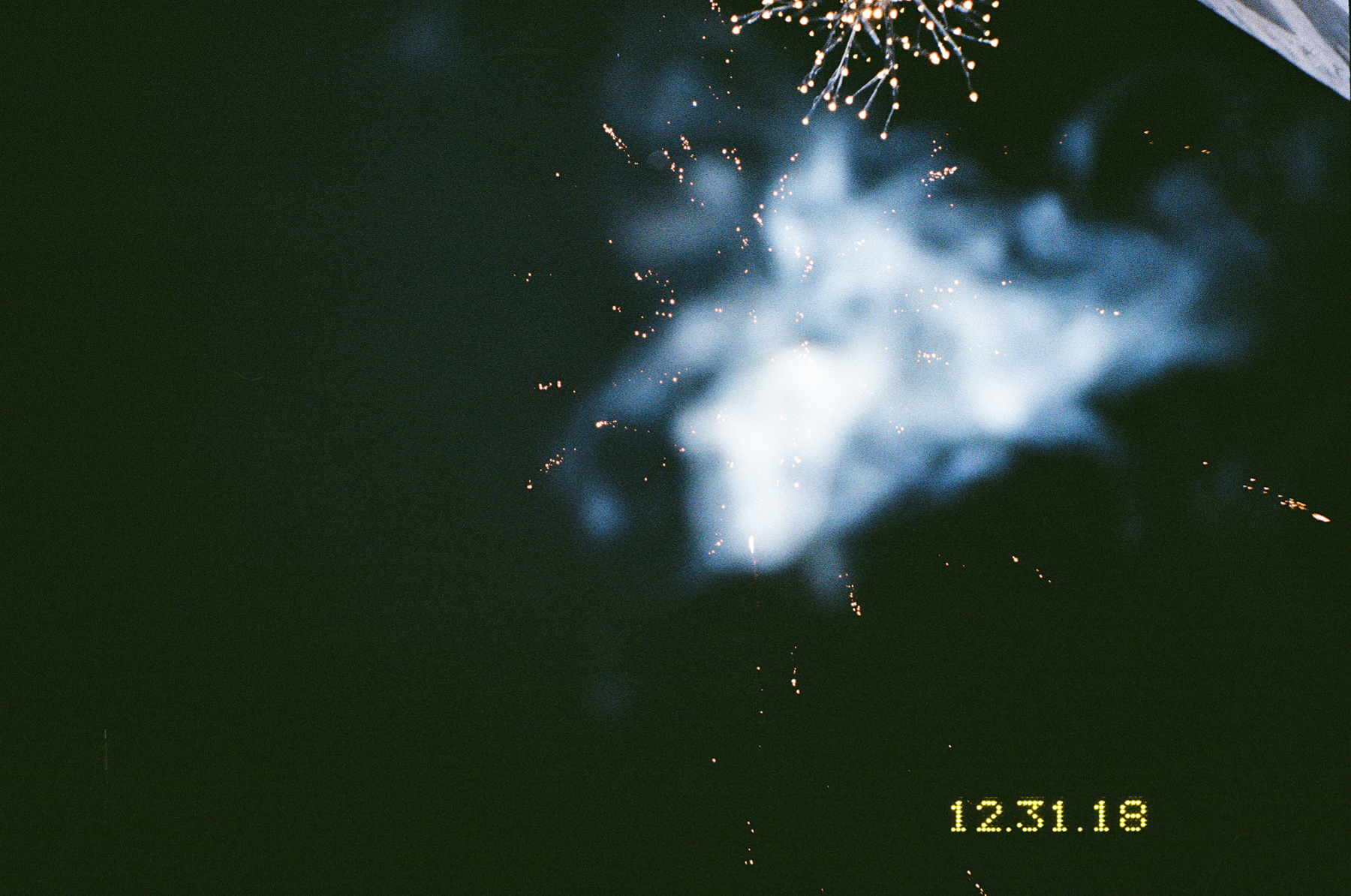 Photograph by Marie Tomanova of the night sky and fireworks going off