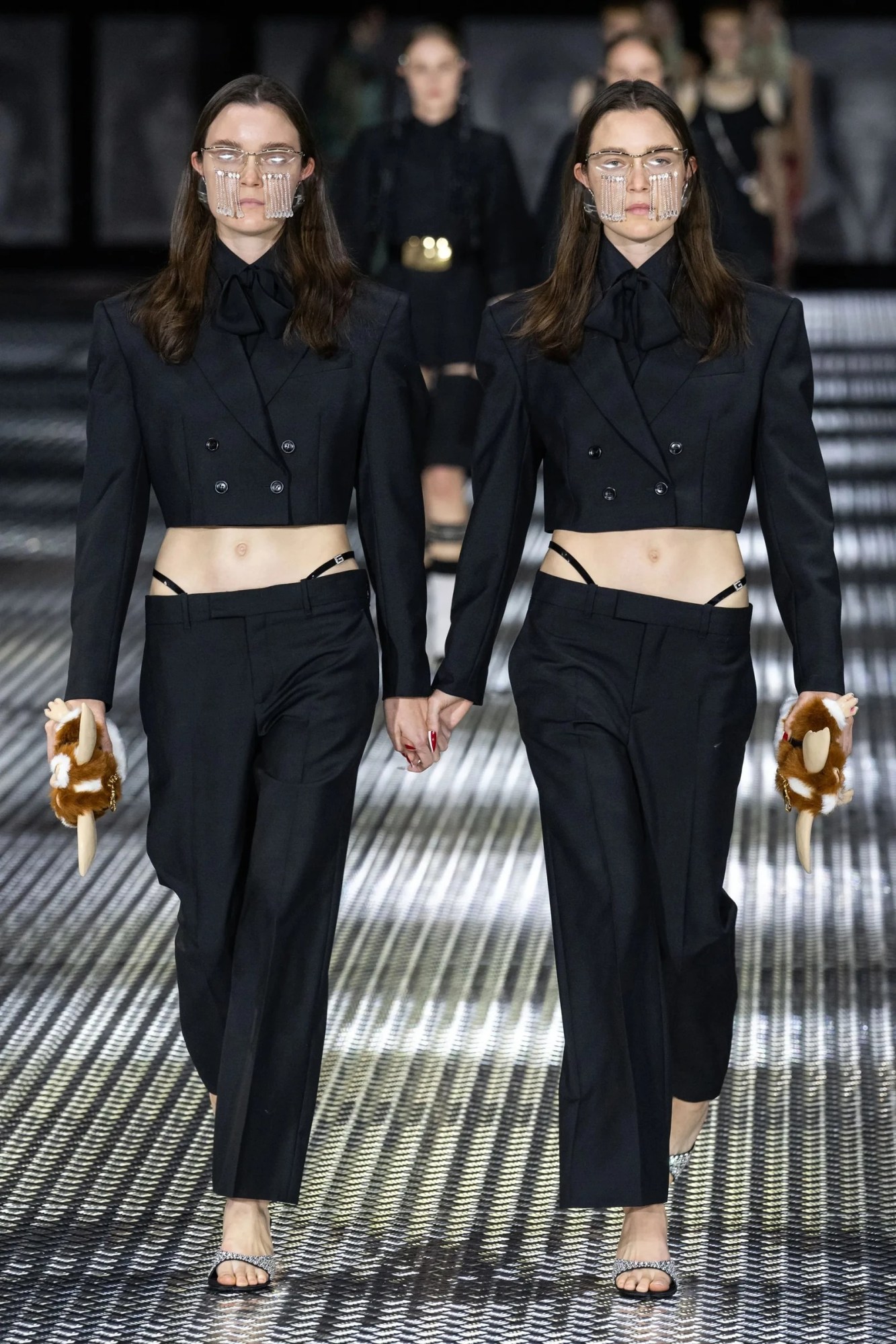 twins walking in black suits at gucci ss23