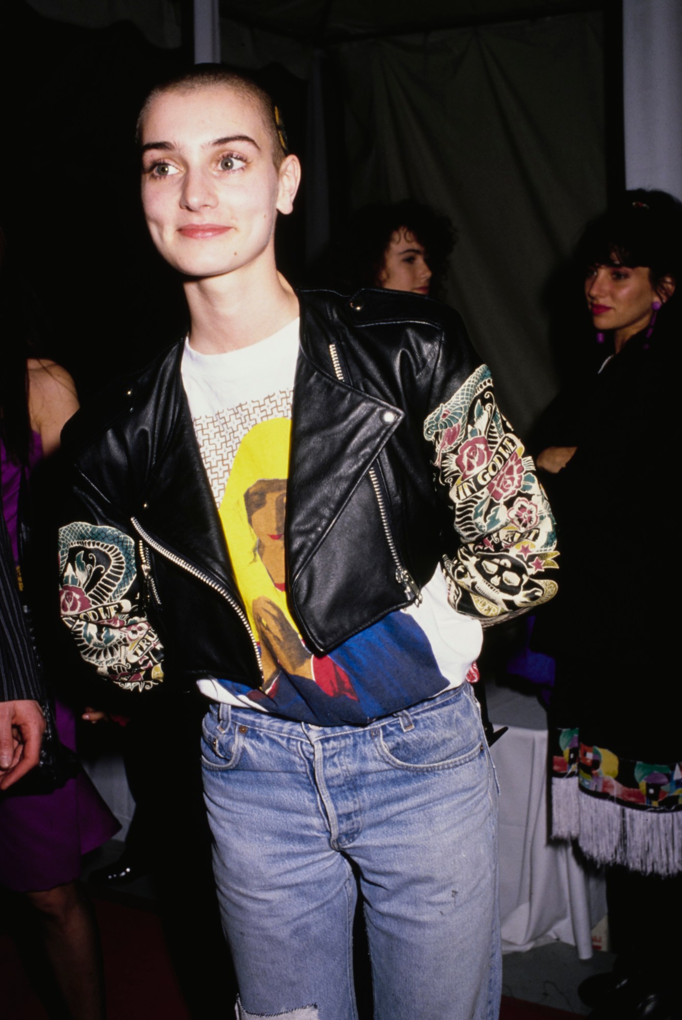 Irish singer-songwriter Sinead O'Connor, wearing a black leather jacket over a t-shirt with an image of a praying Virgin Mary, attends the 31st Annual Grammy Awards, held at the Shrine Auditorium in Los Angeles, California, 22nd February 1989.