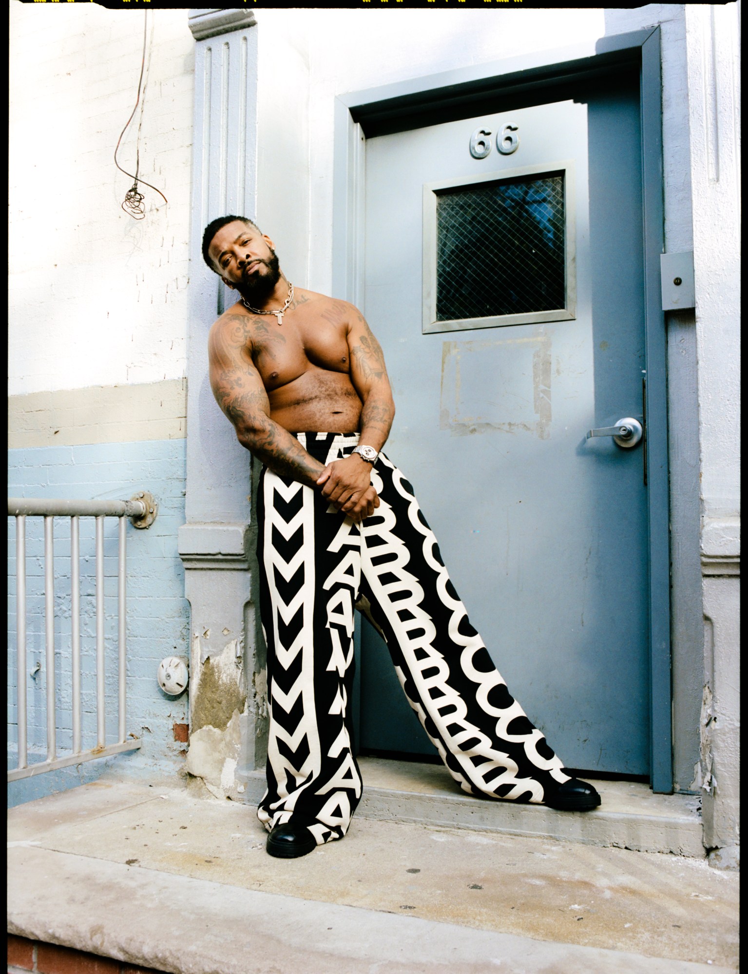 Lester Walker posing at Dr. Clark's wearing Marc Jacobs Monogram Collection