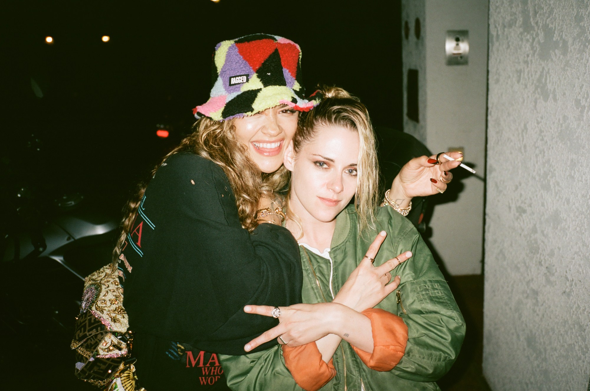 rita ora and kristen stewart pose together in the smoking area