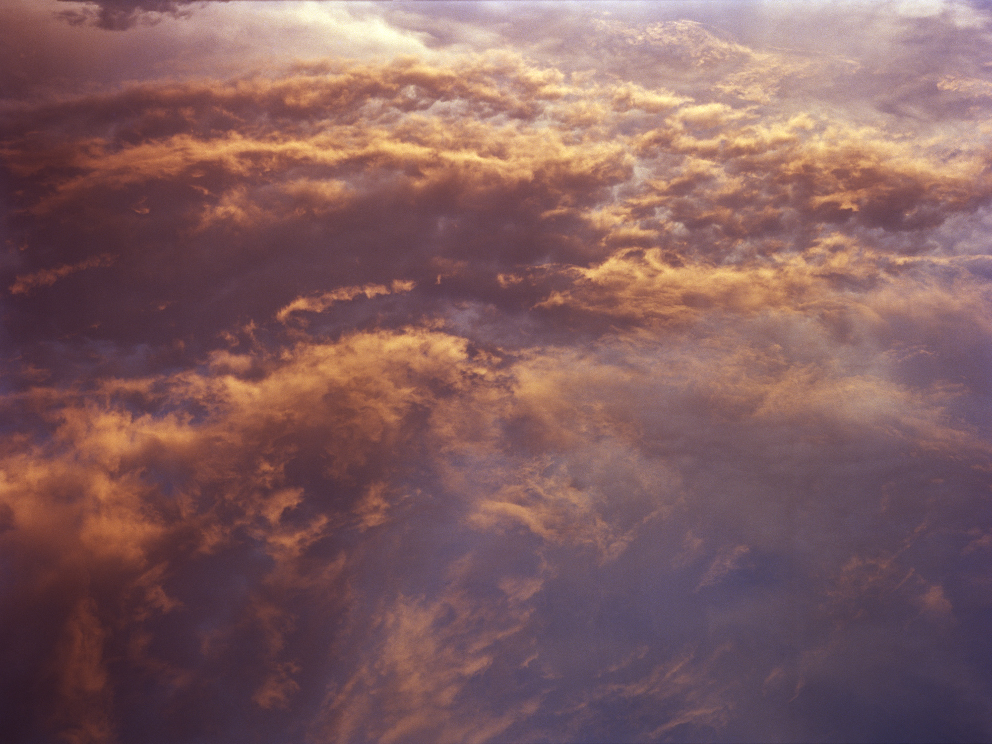 photograph by Shaniqwa Jarvis of clouds in a purple sky