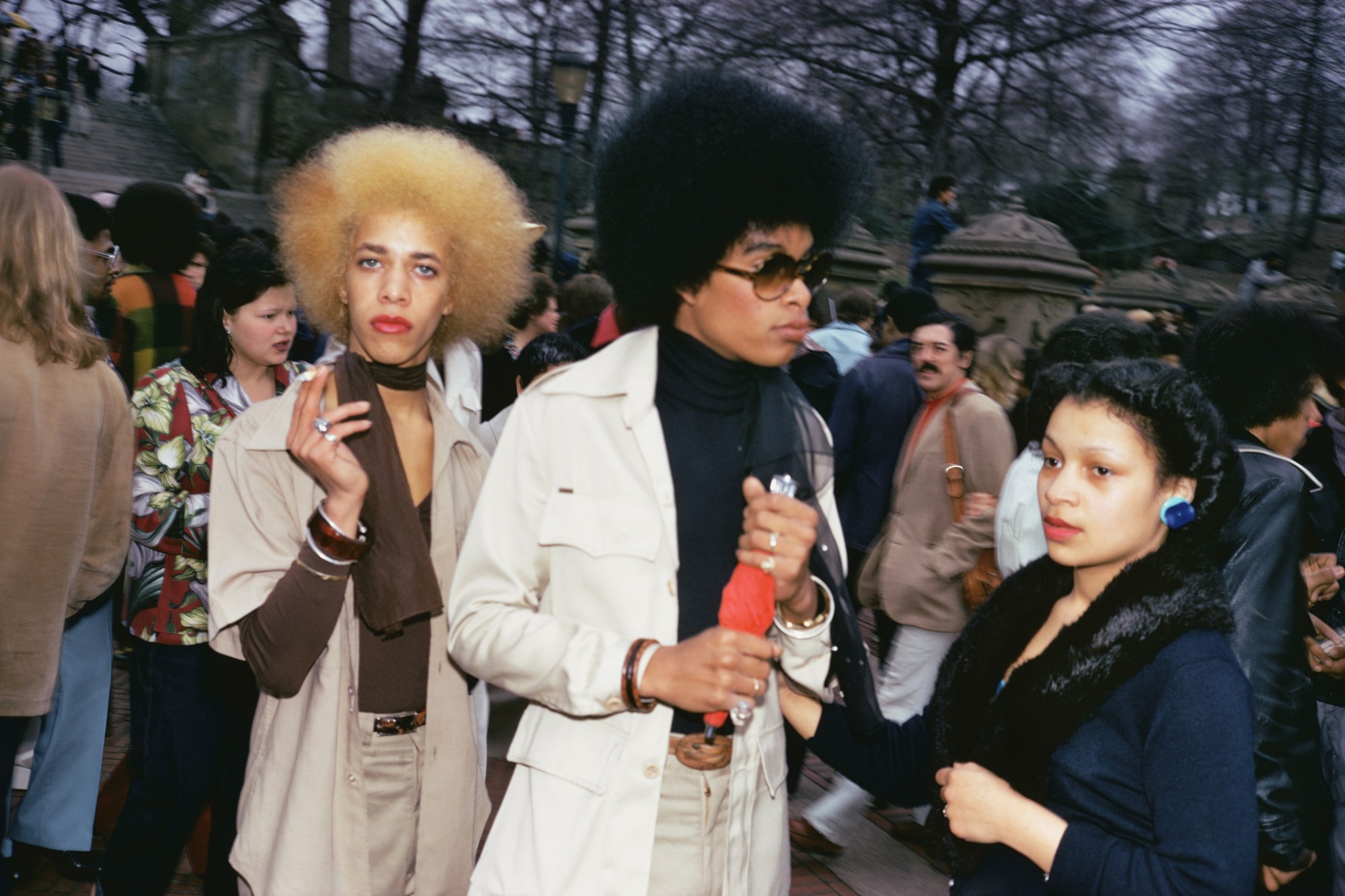 two people with afros smoking cigarettes in central park 1970s