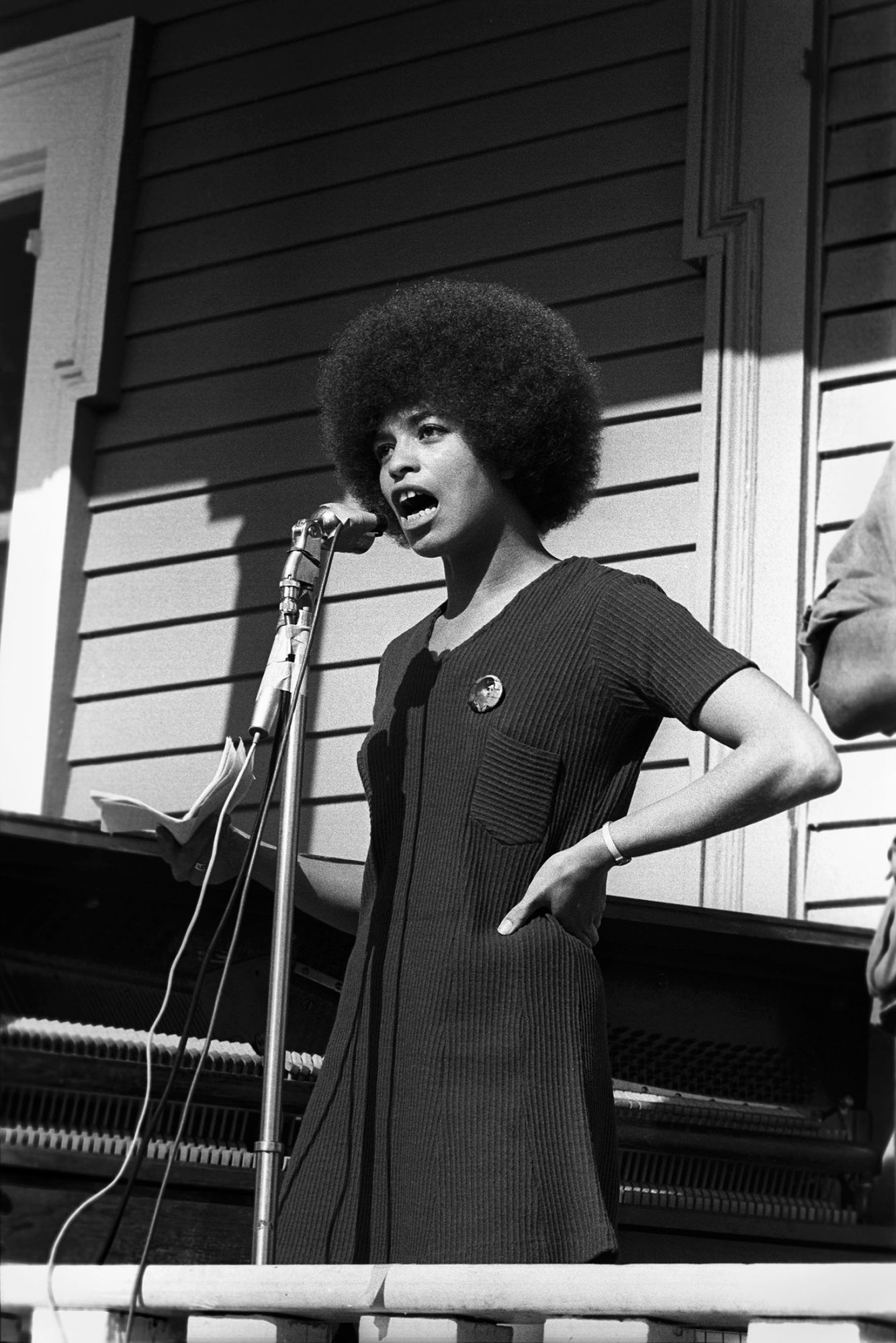 black-and-white photo of a women of the black panther party giving a speech