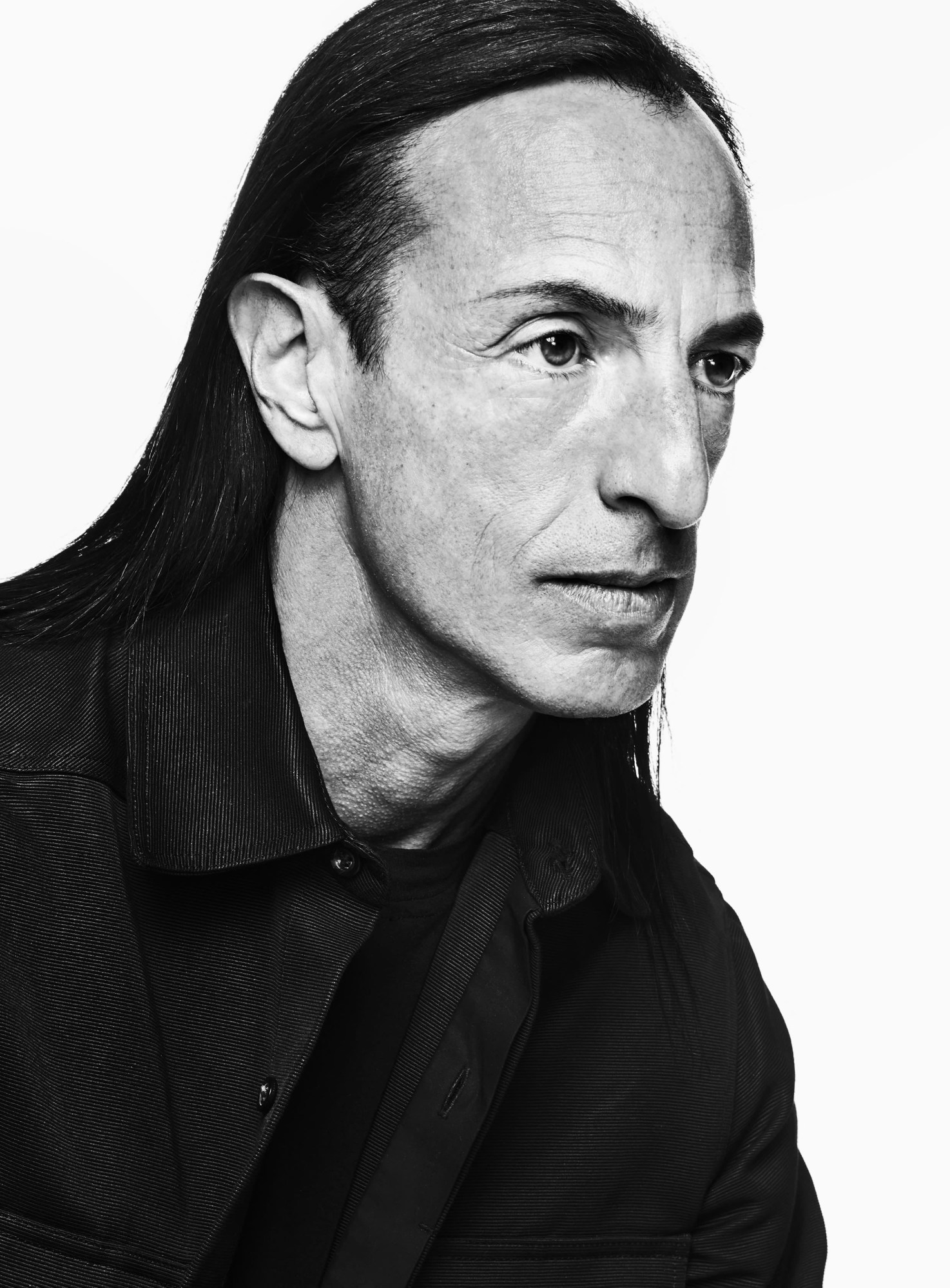 A portrait of Rick Owens wearing a black jacket