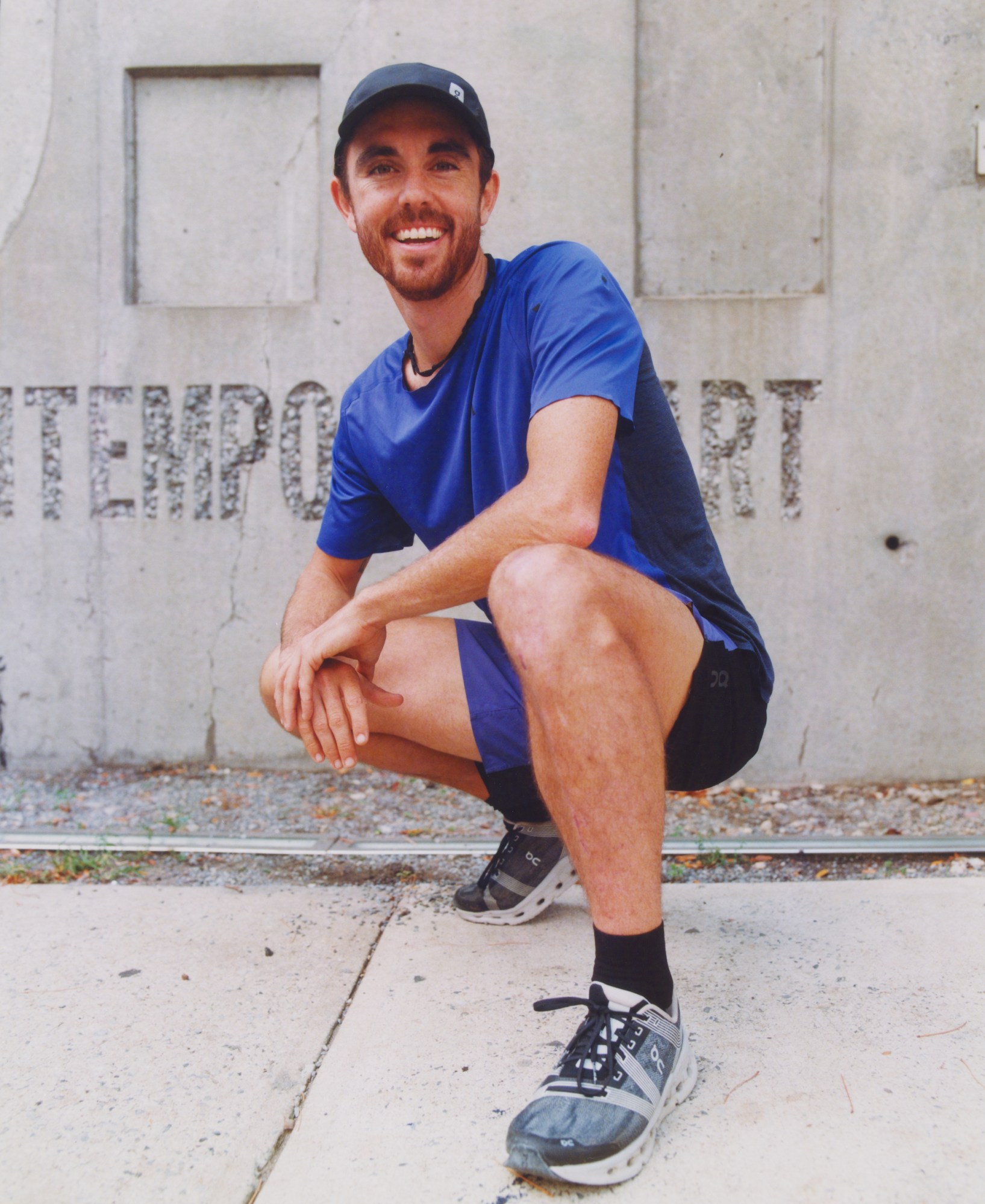 portrait of david kilgore kneeling outside moma ps1