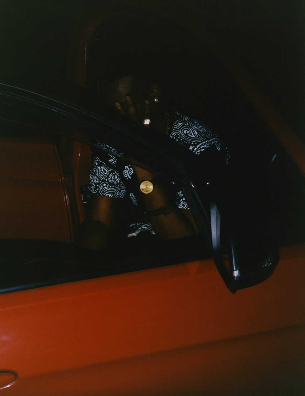 DJ Mac in a car photographed by Jeano Edwards for i-D’s The Royalty Issue, no. 370, Winter 2022