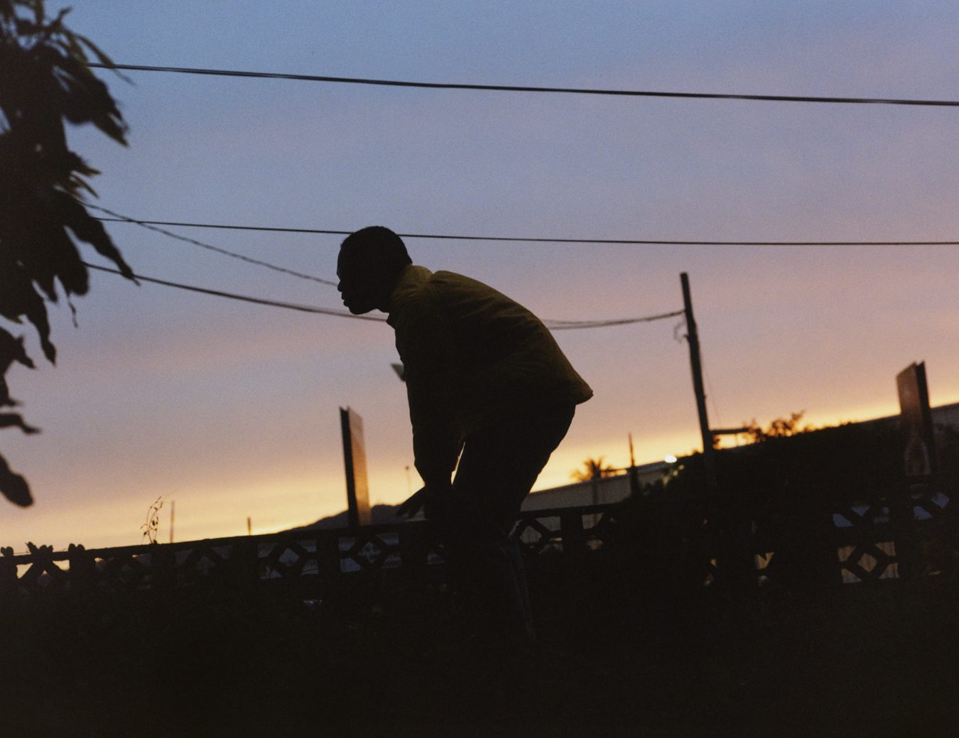 Valiant's silhouette standing at sunset photographed by Jeano Edwards for i-D’s The Royalty Issue, no. 370, Winter 2022