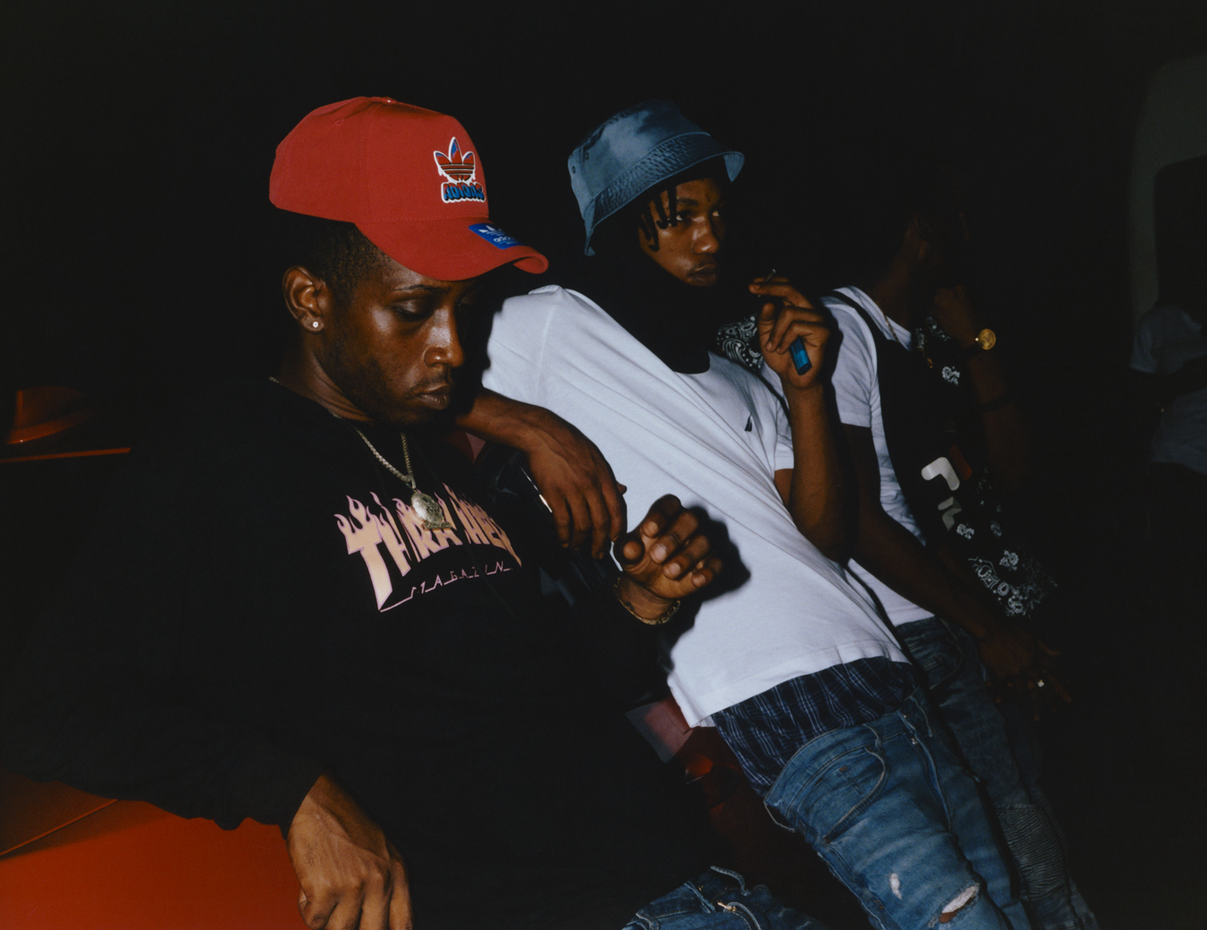 DJ Baba, Paddy and Wilo Don leaning against a car photographed by Jeano Edwards for i-D’s The Royalty Issue, no. 370, Winter 2022