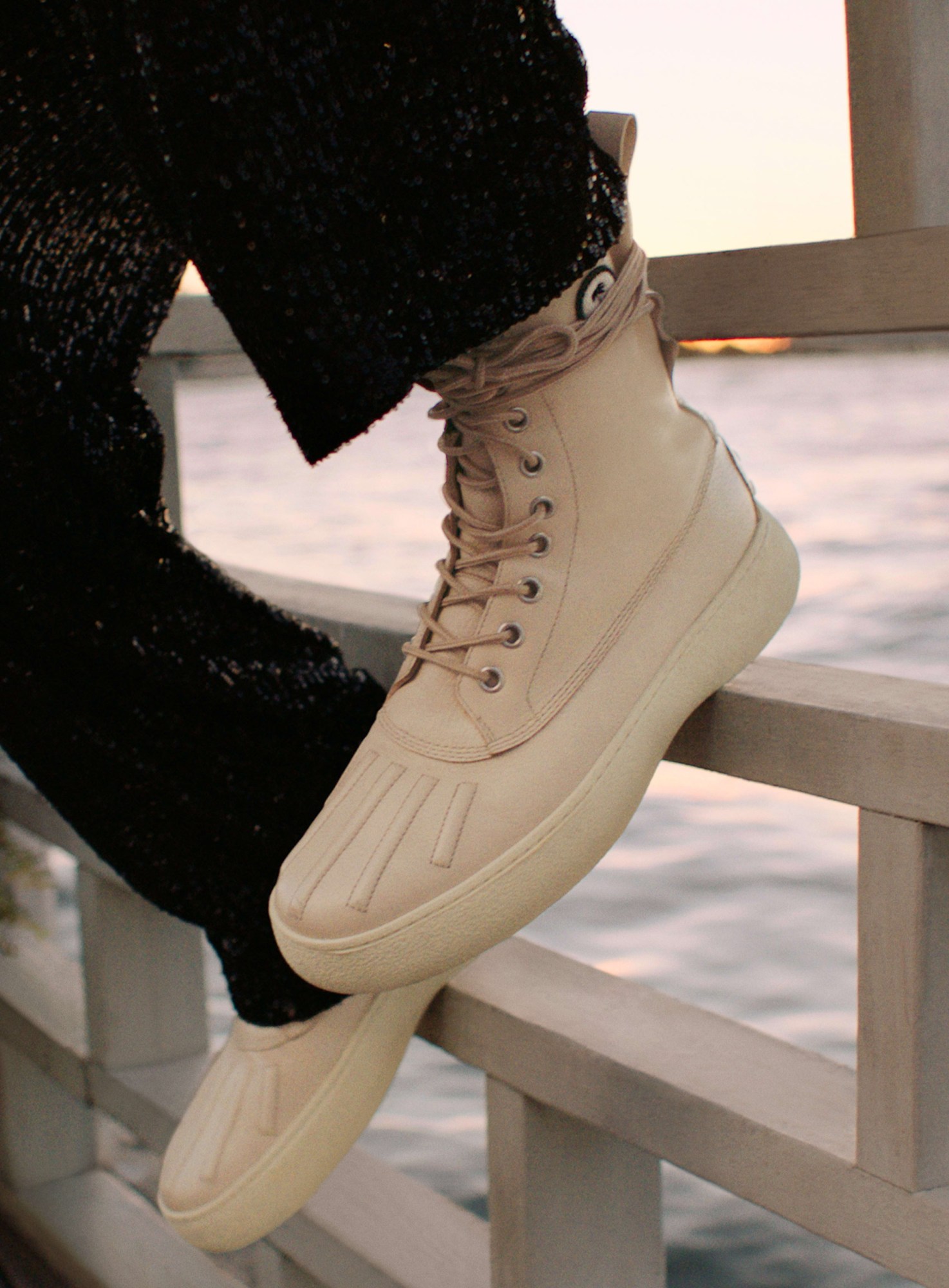 a close up of white leather boots