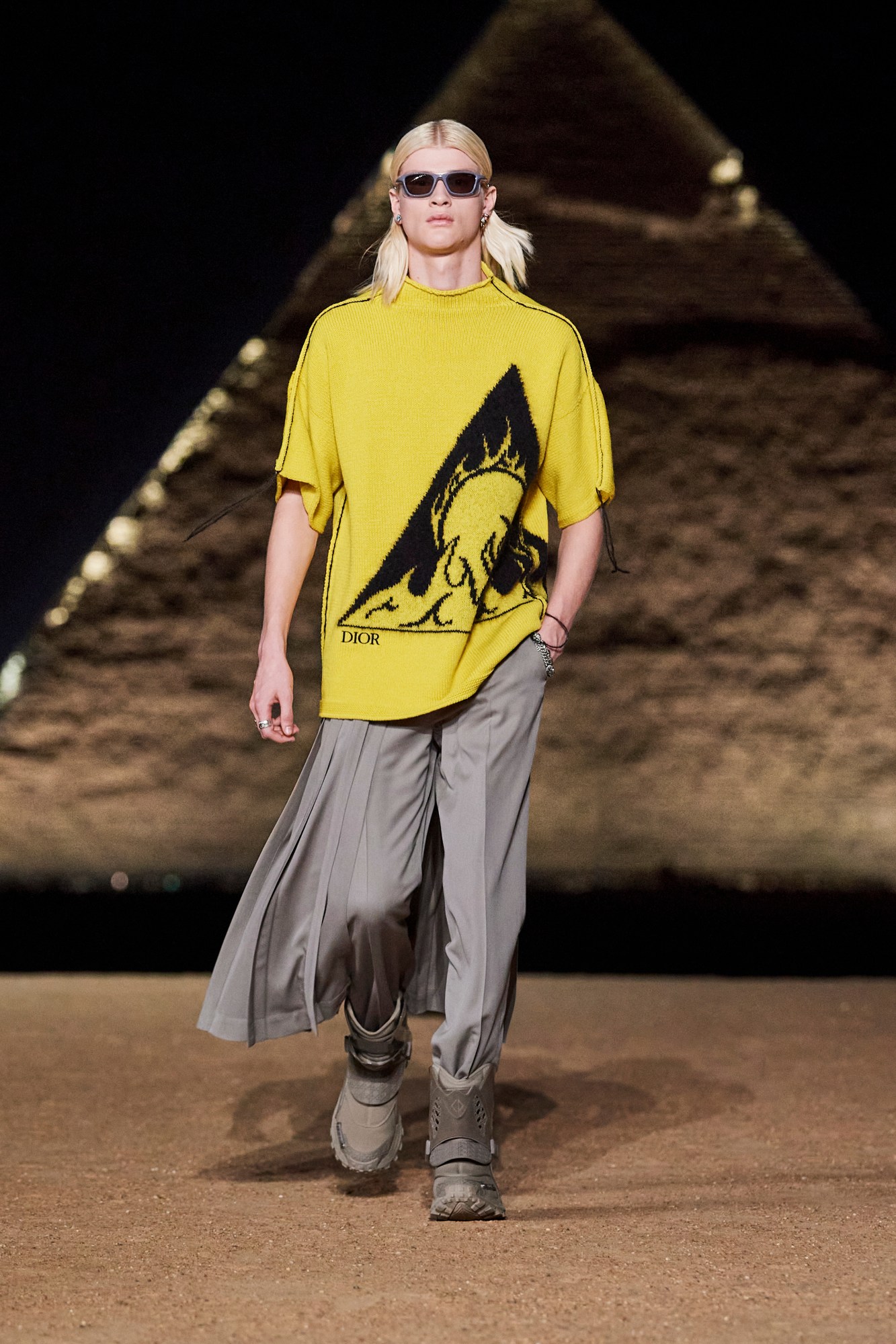 Model walking for Dior pre-fall 2023 show in Cairo, Egypt in front of the pyramids