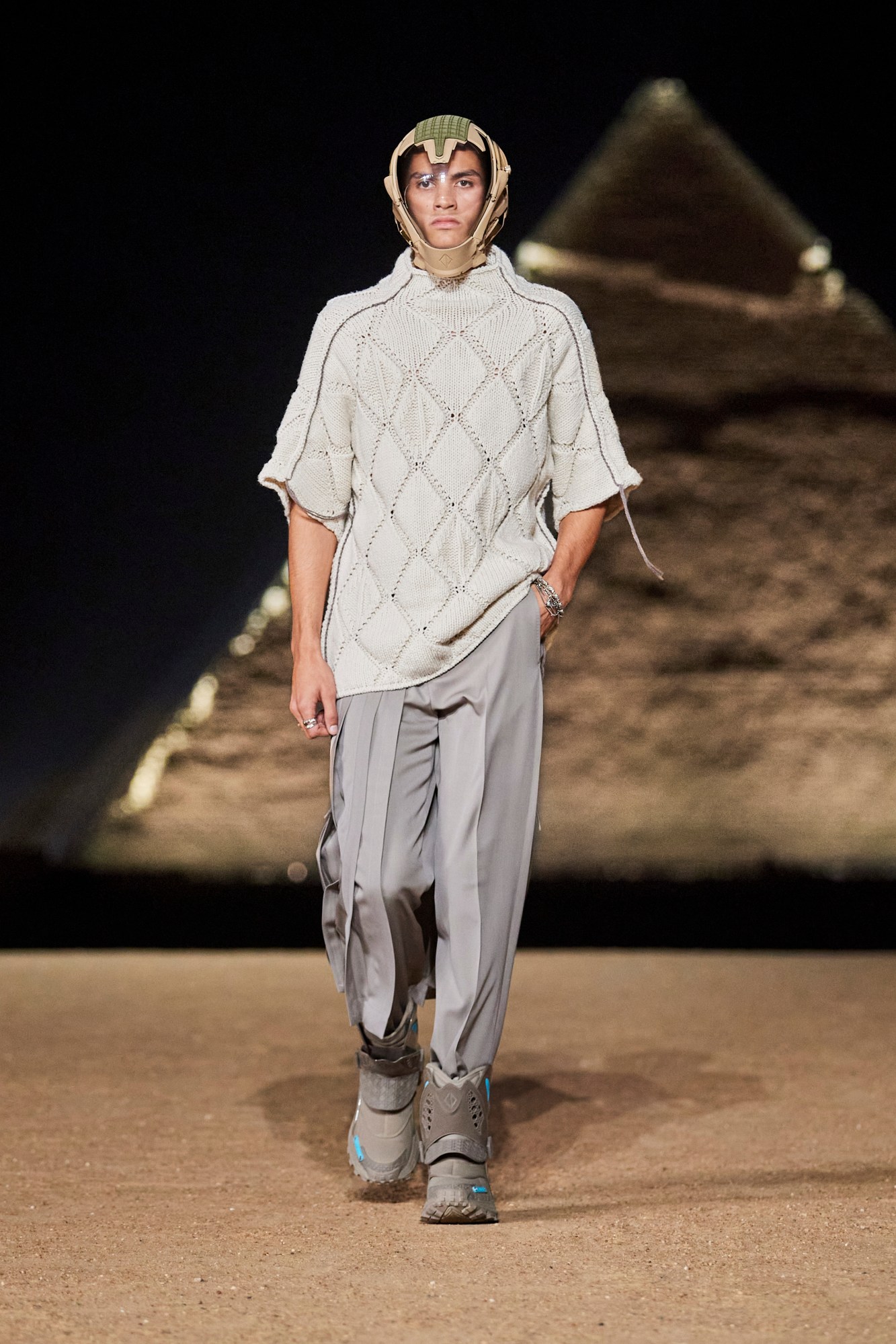 Model walking for Dior pre-fall 2023 show in Cairo, Egypt in front of the pyramids