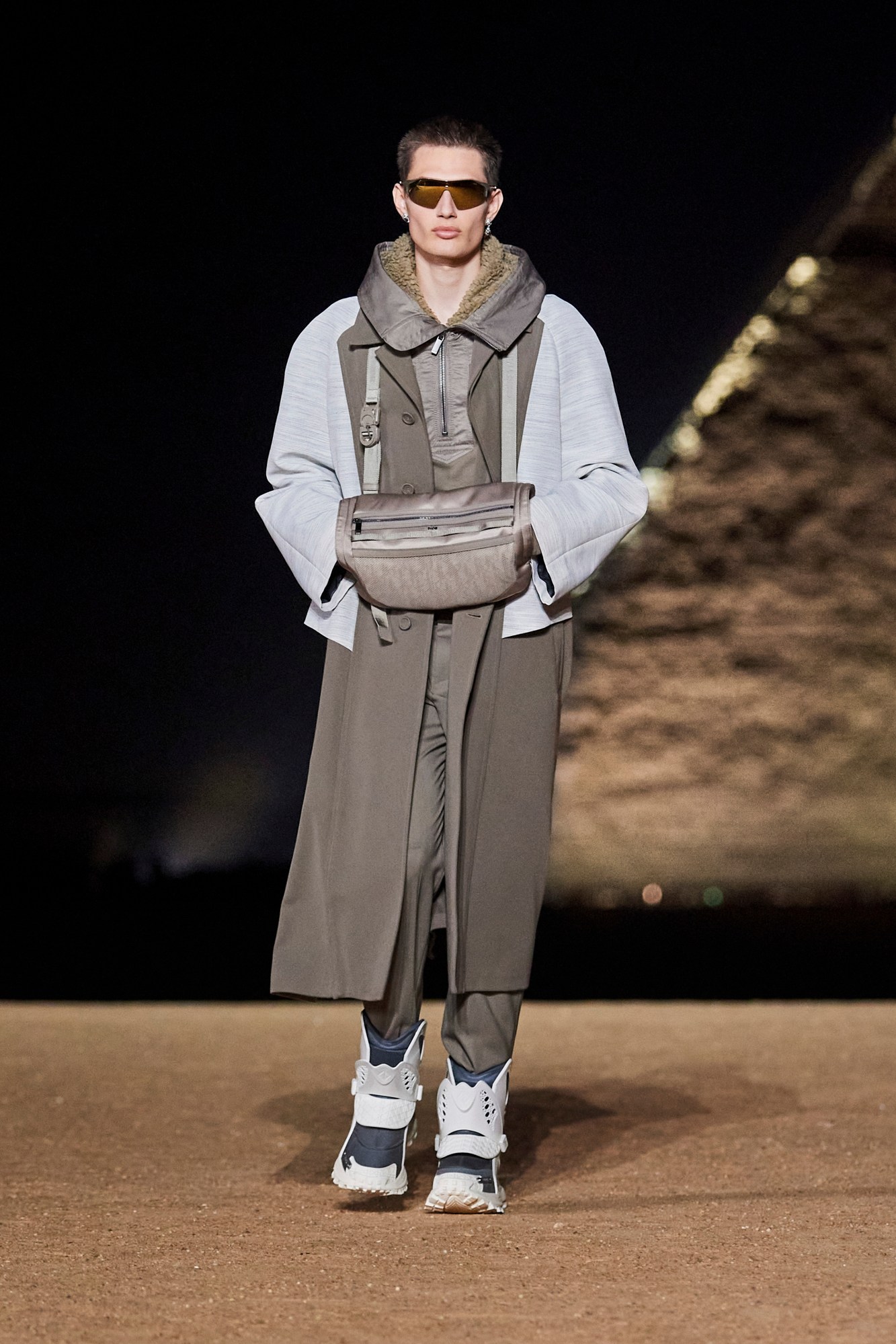 Model walking for Dior pre-fall 2023 show in Cairo, Egypt in front of the pyramids