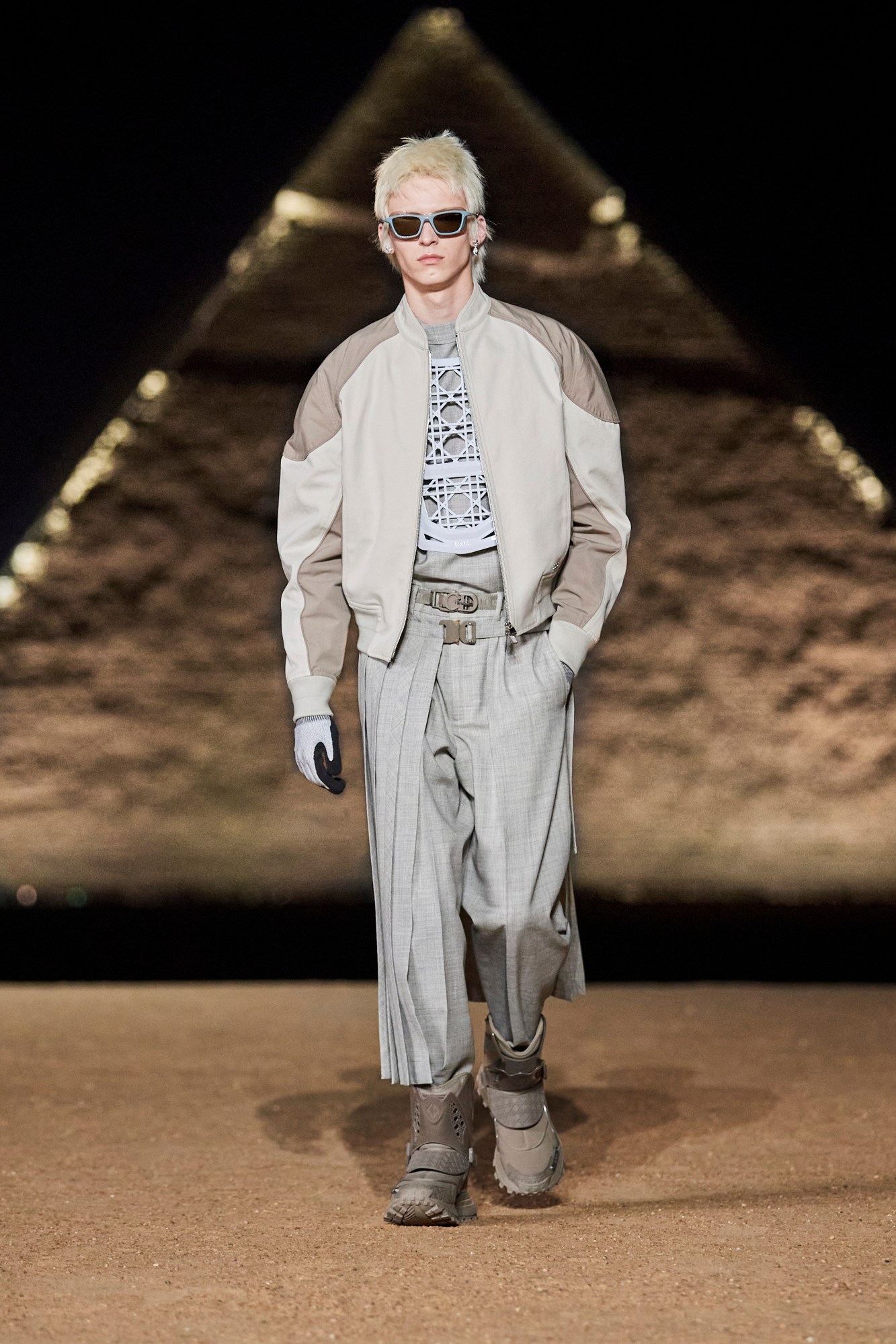 Model walking for Dior pre-fall 2023 show in Cairo, Egypt in front of the pyramids