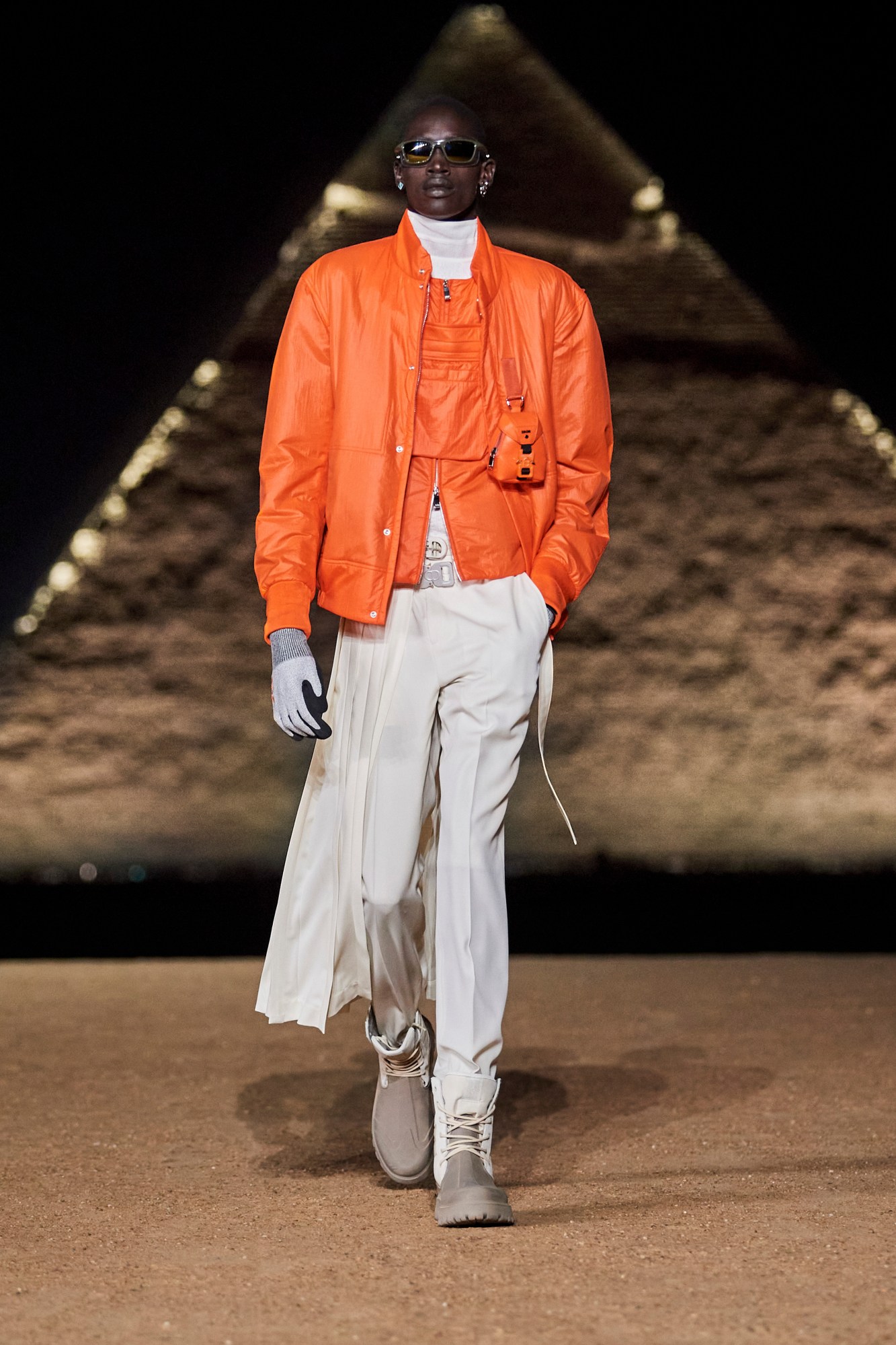 Model walking for Dior pre-fall 2023 show in Cairo, Egypt in front of the pyramids