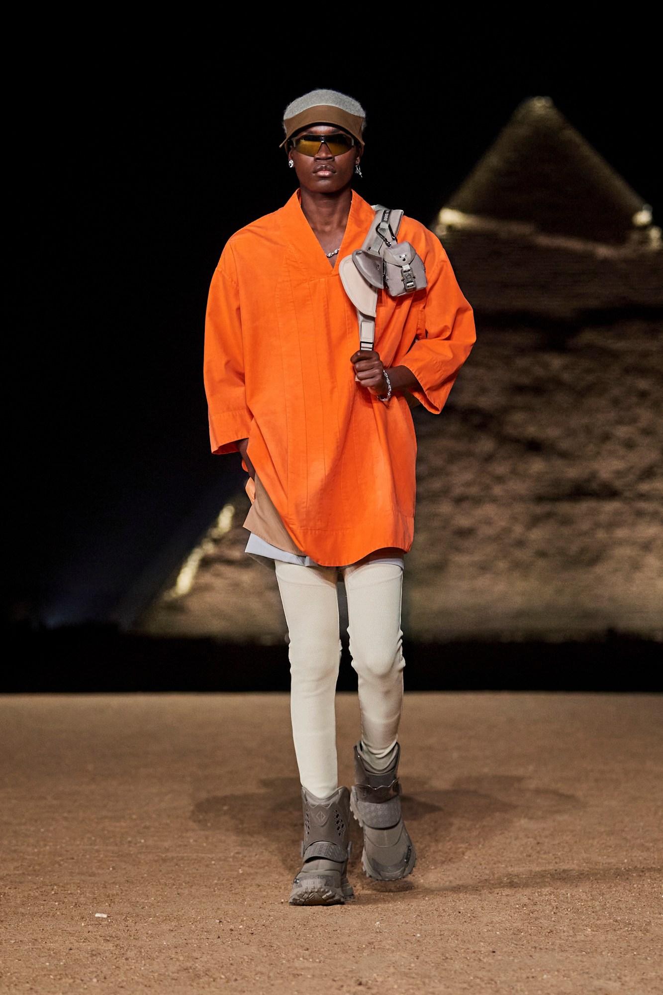 Model walking for Dior pre-fall 2023 show in Cairo, Egypt in front of the pyramids