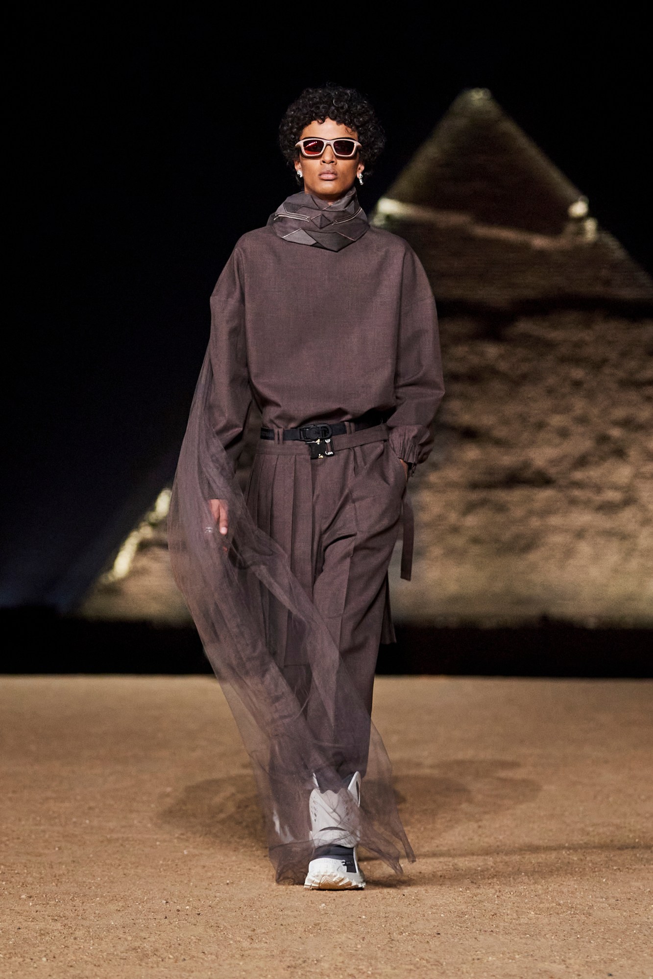 Model walking for Dior pre-fall 2023 show in Cairo, Egypt in front of the pyramids