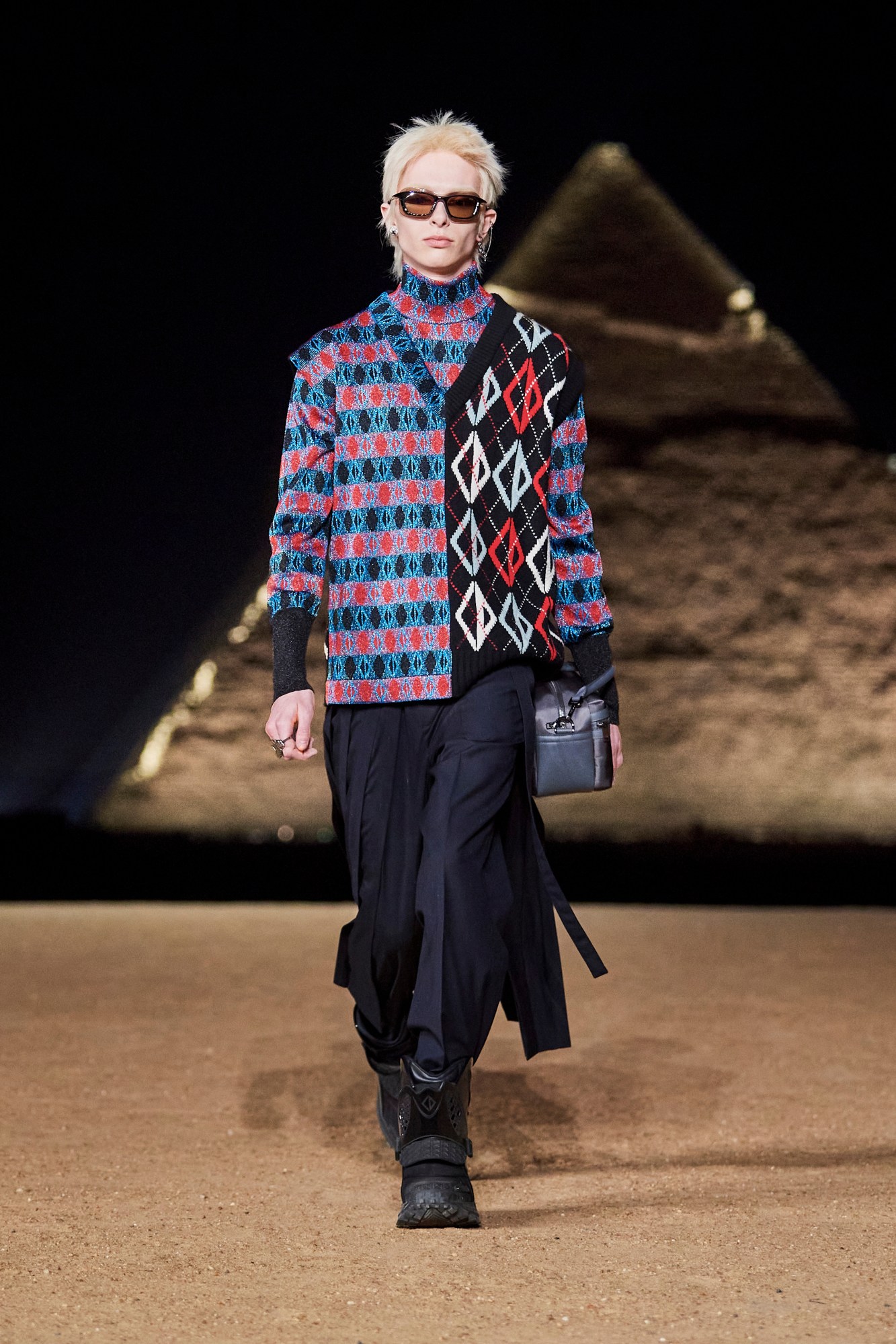 Model walking for Dior pre-fall 2023 show in Cairo, Egypt in front of the pyramids