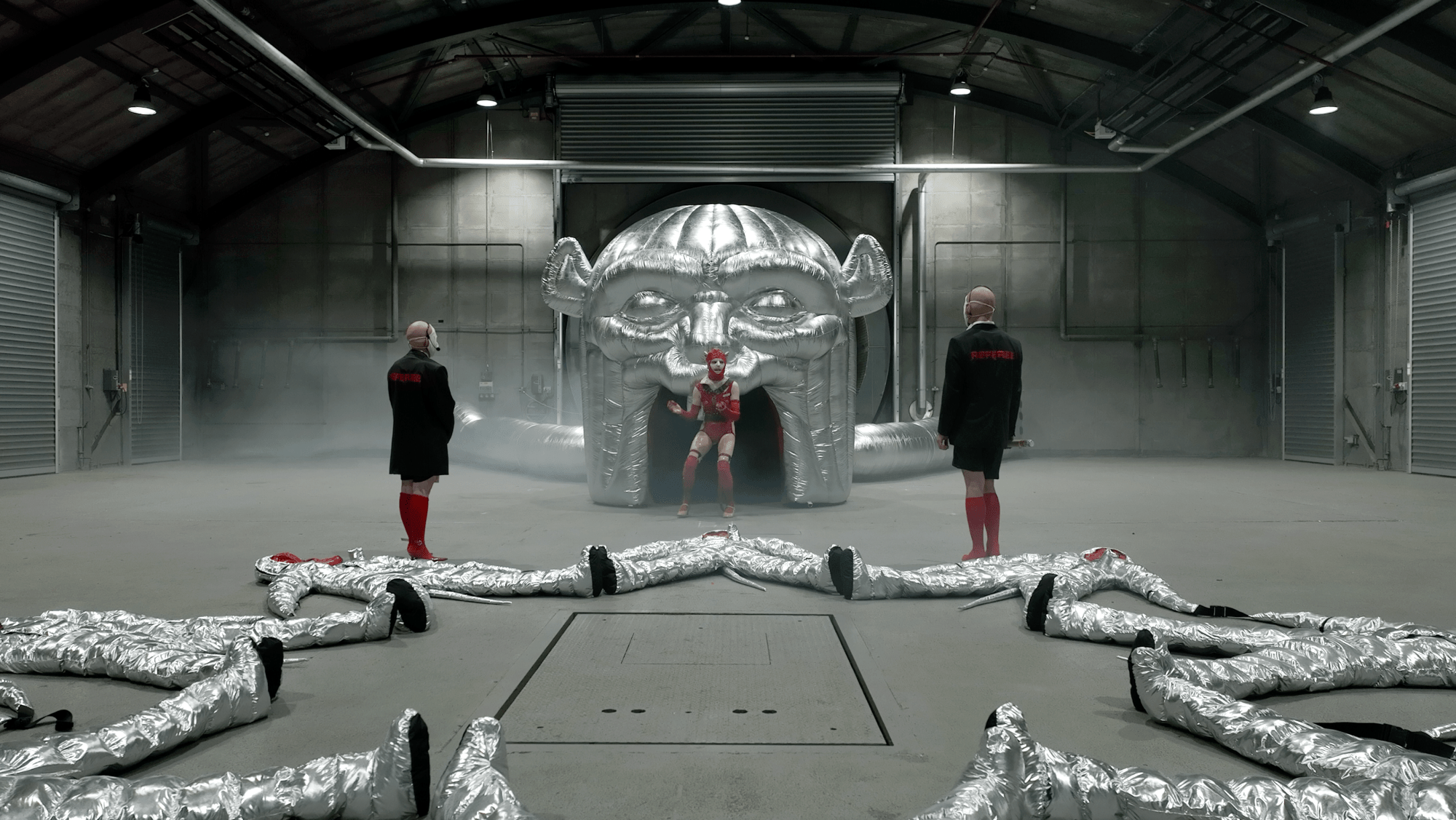 An inflatable portal flanked by people.