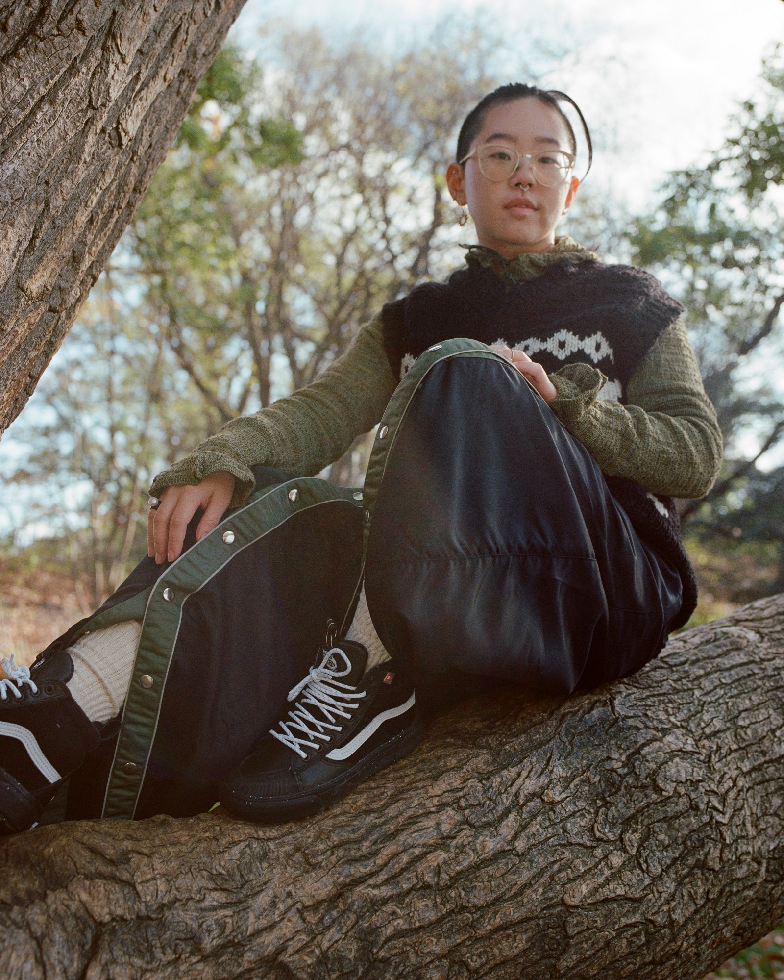 portraits of brown girls climb wearing vans