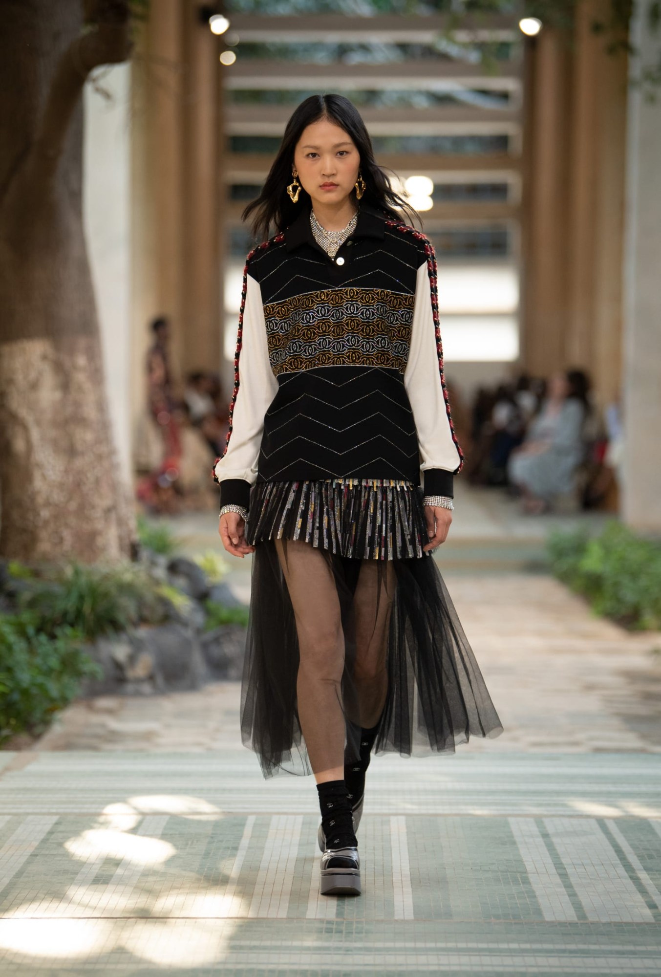 Model walking for Chanel pre-fall show 2023