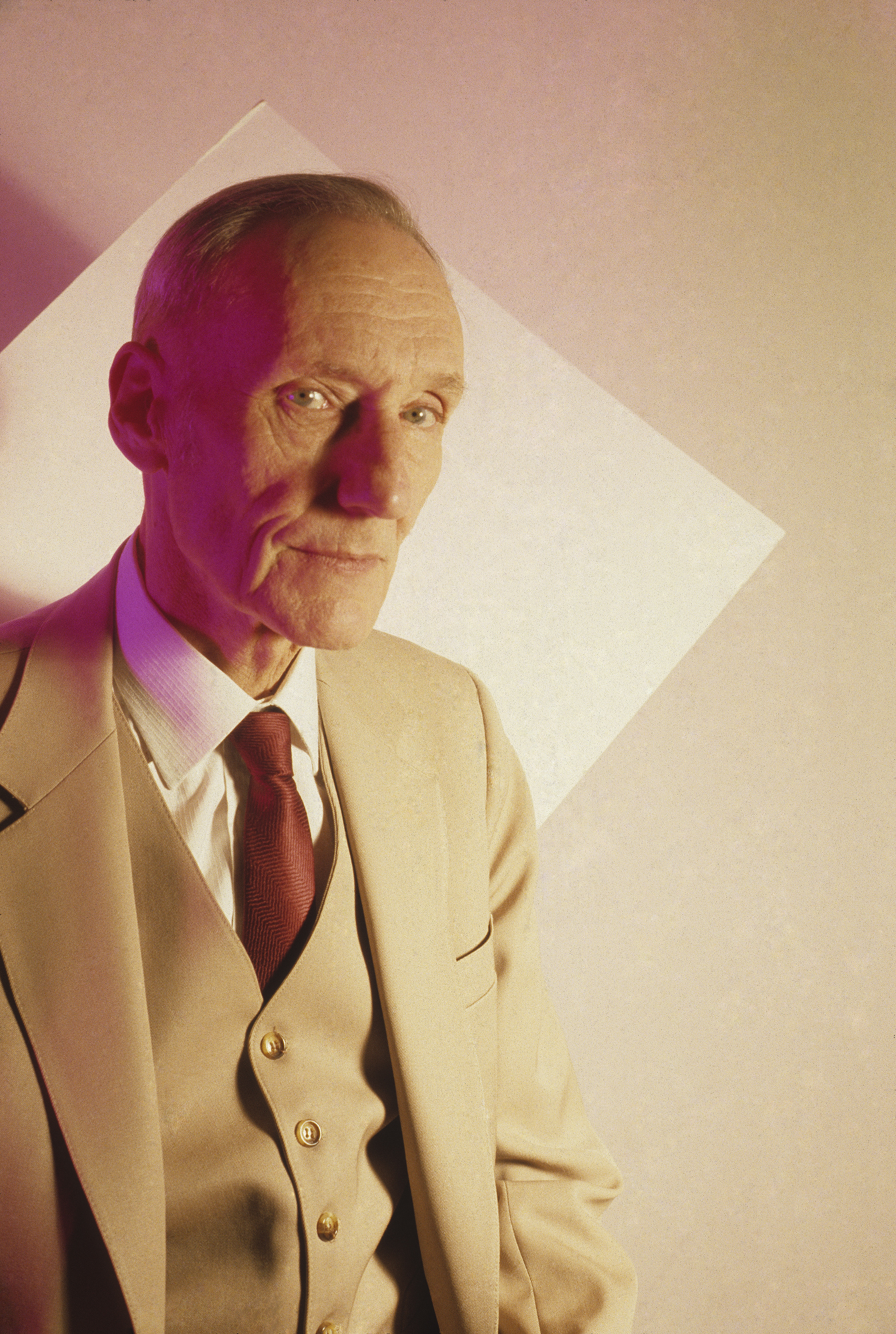 william burroughs in a cream suit shot by jimmy desana