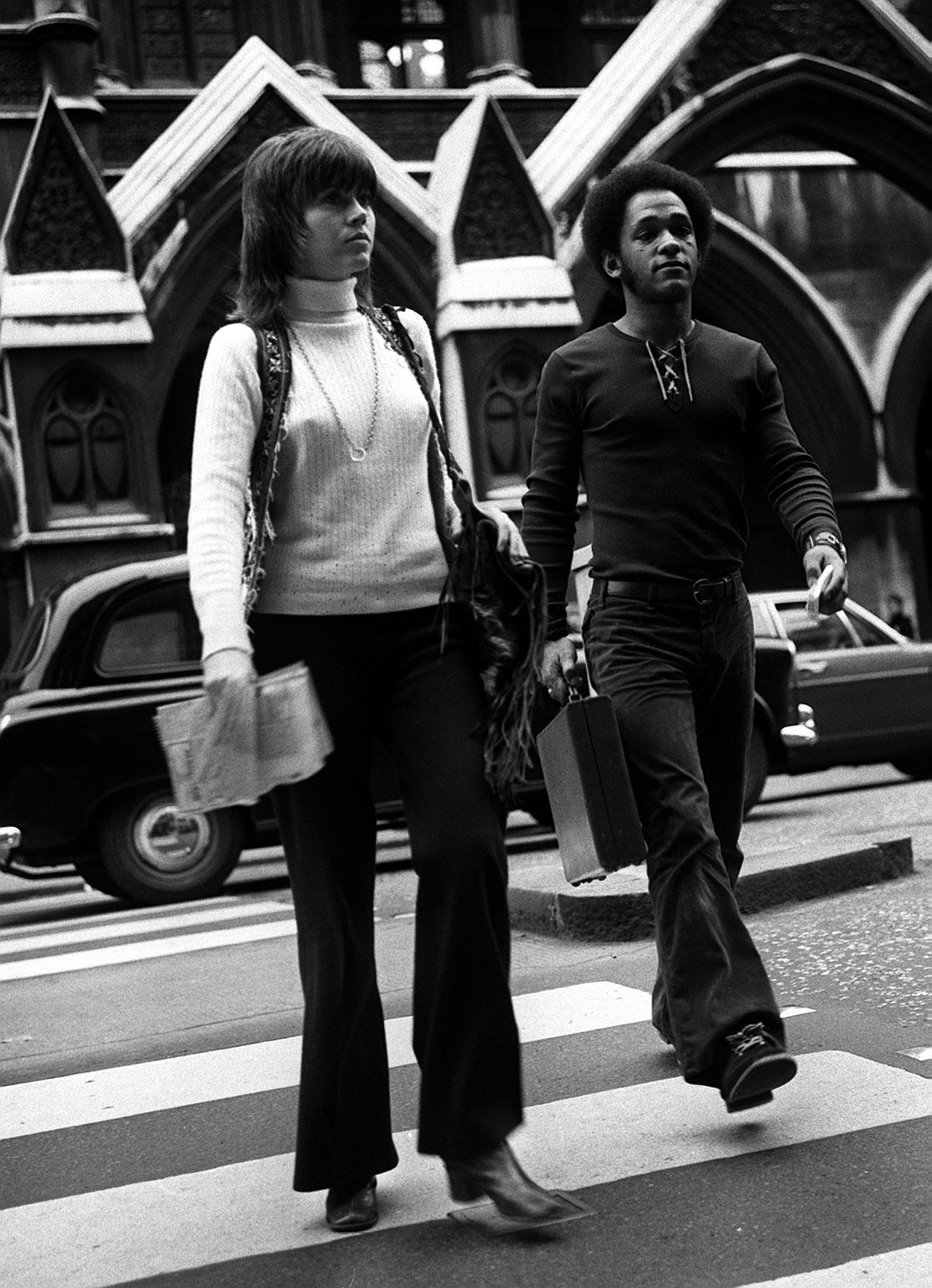 jane fonda crossing the street in a turtleneck and flare pants 1971