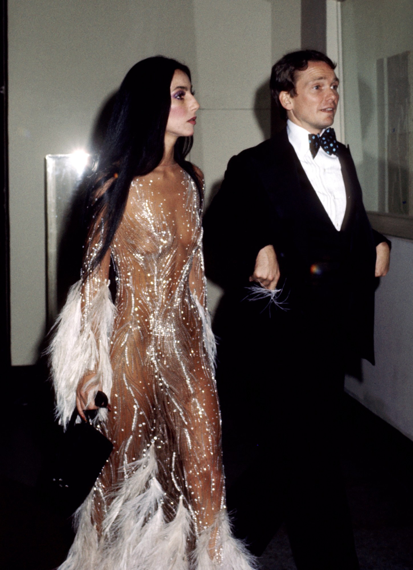 cher walking into the met gala in a sheer sequinned naked dress 1974