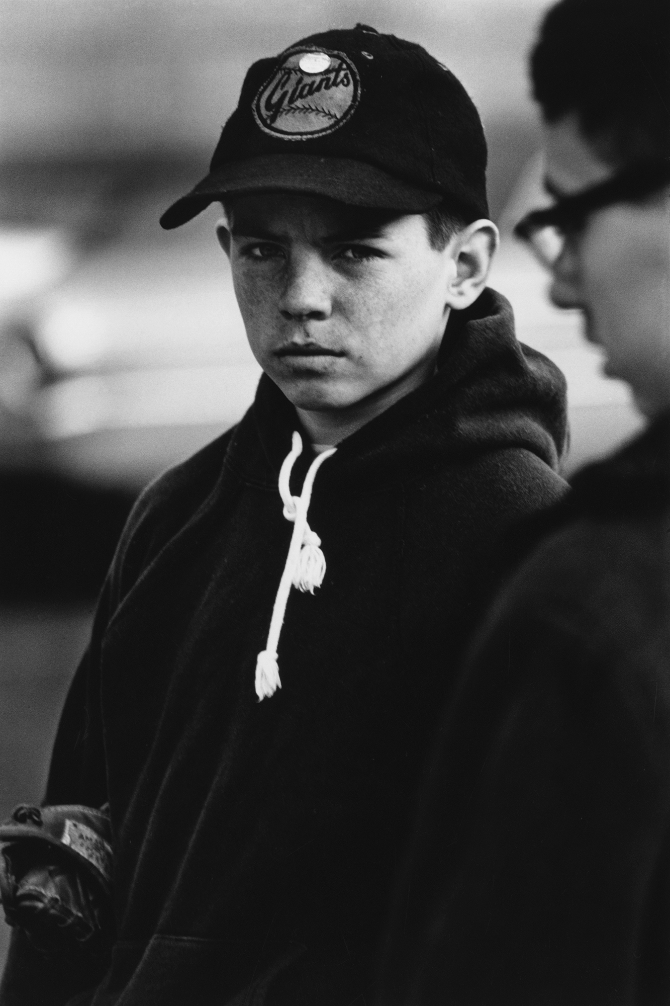 a young boy in a 'giants' baseball cap