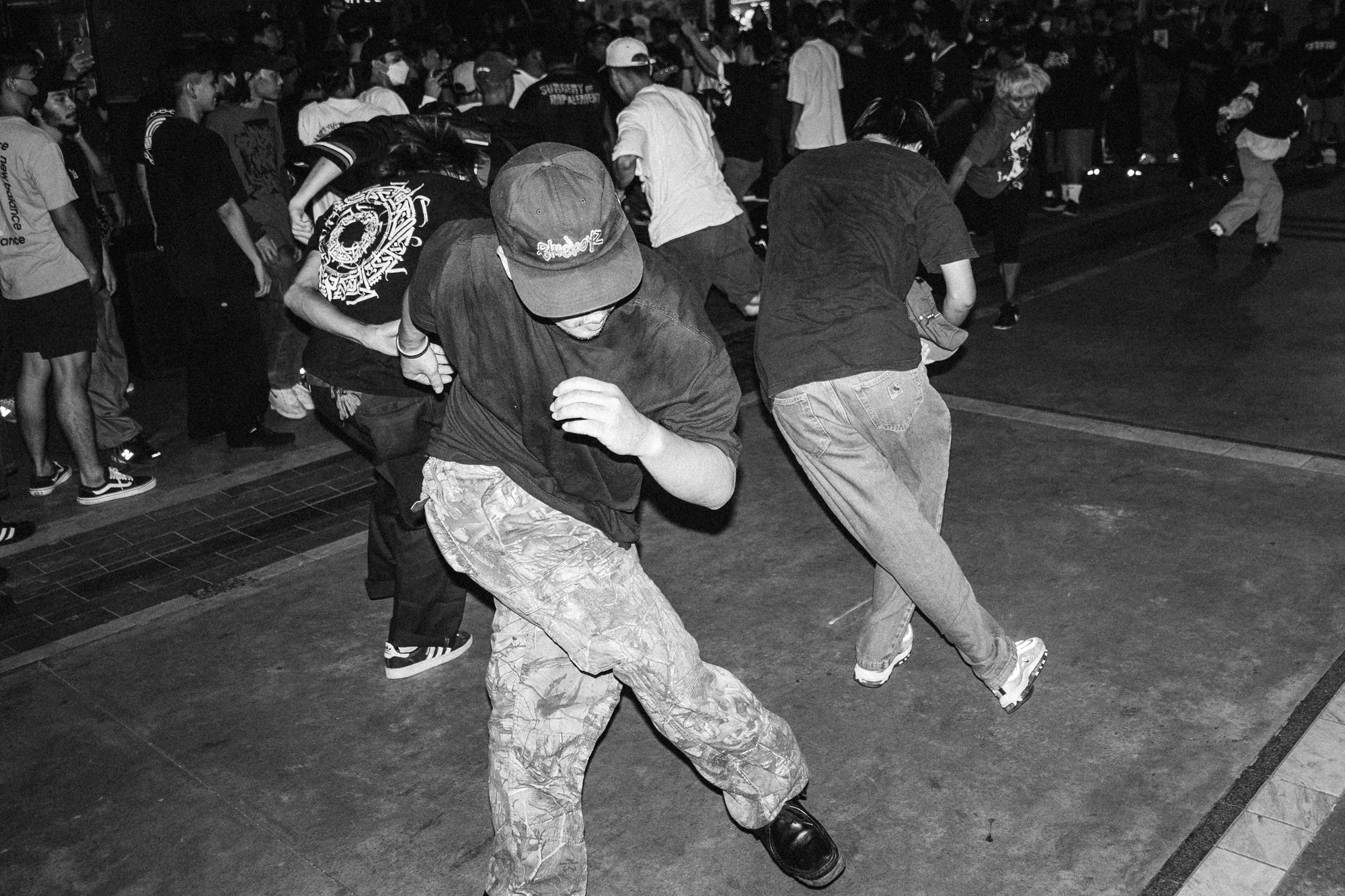 black-and-white image of people dancing in a club