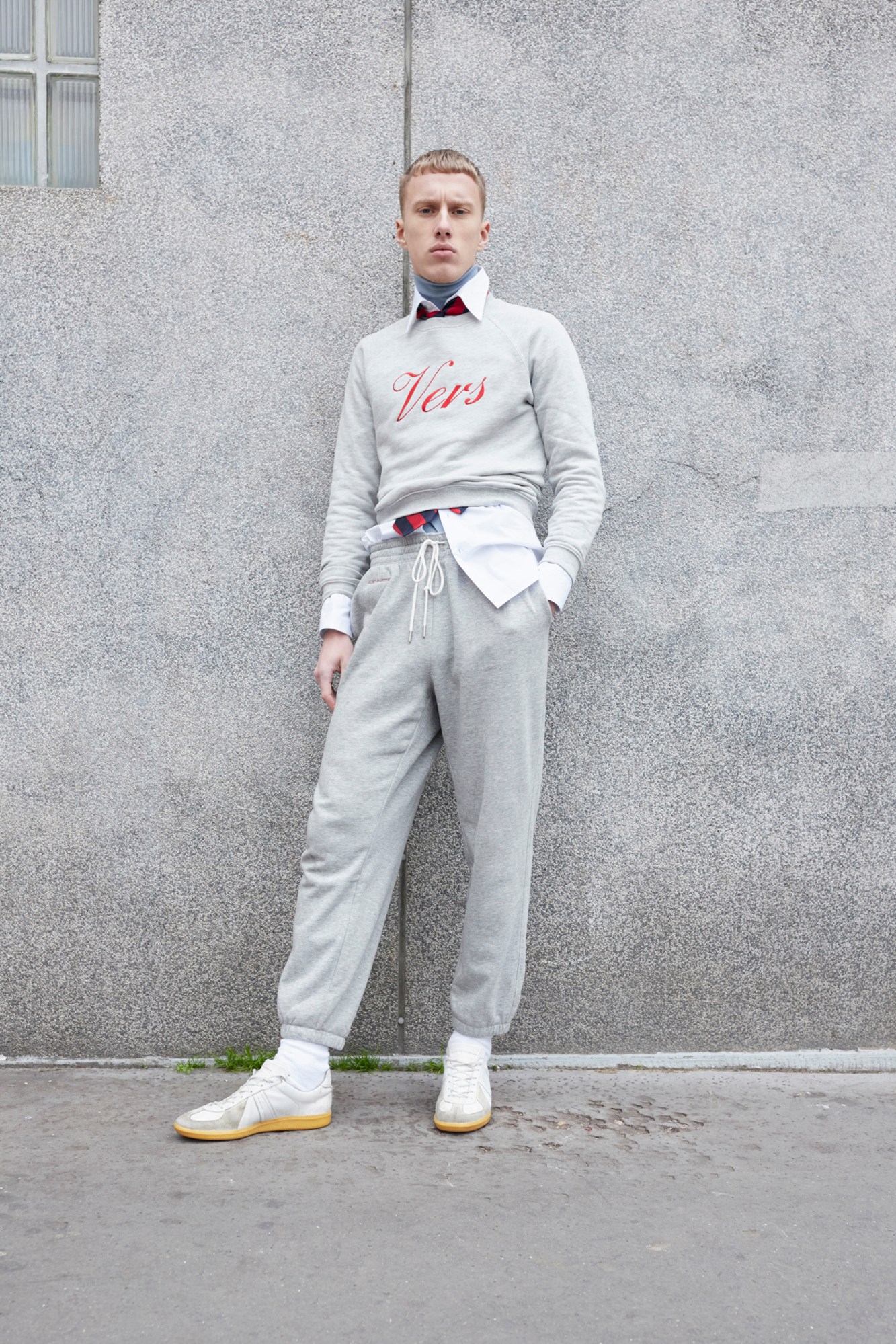 Model wearing grey sweatpants in the Alled-Martinez AW22 lookbook