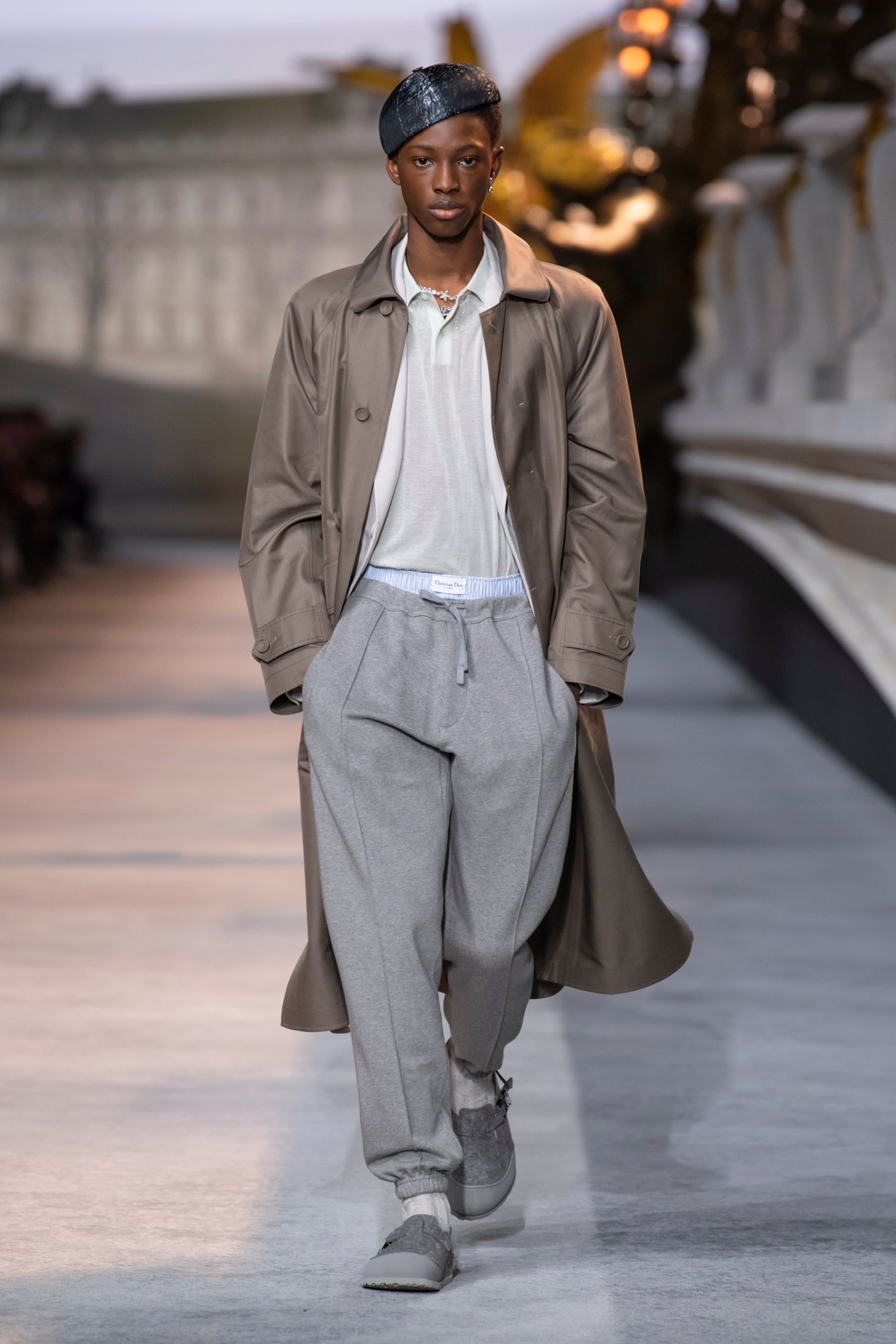 Model wearing grey sweatpants at the Dior Mens AW22 show