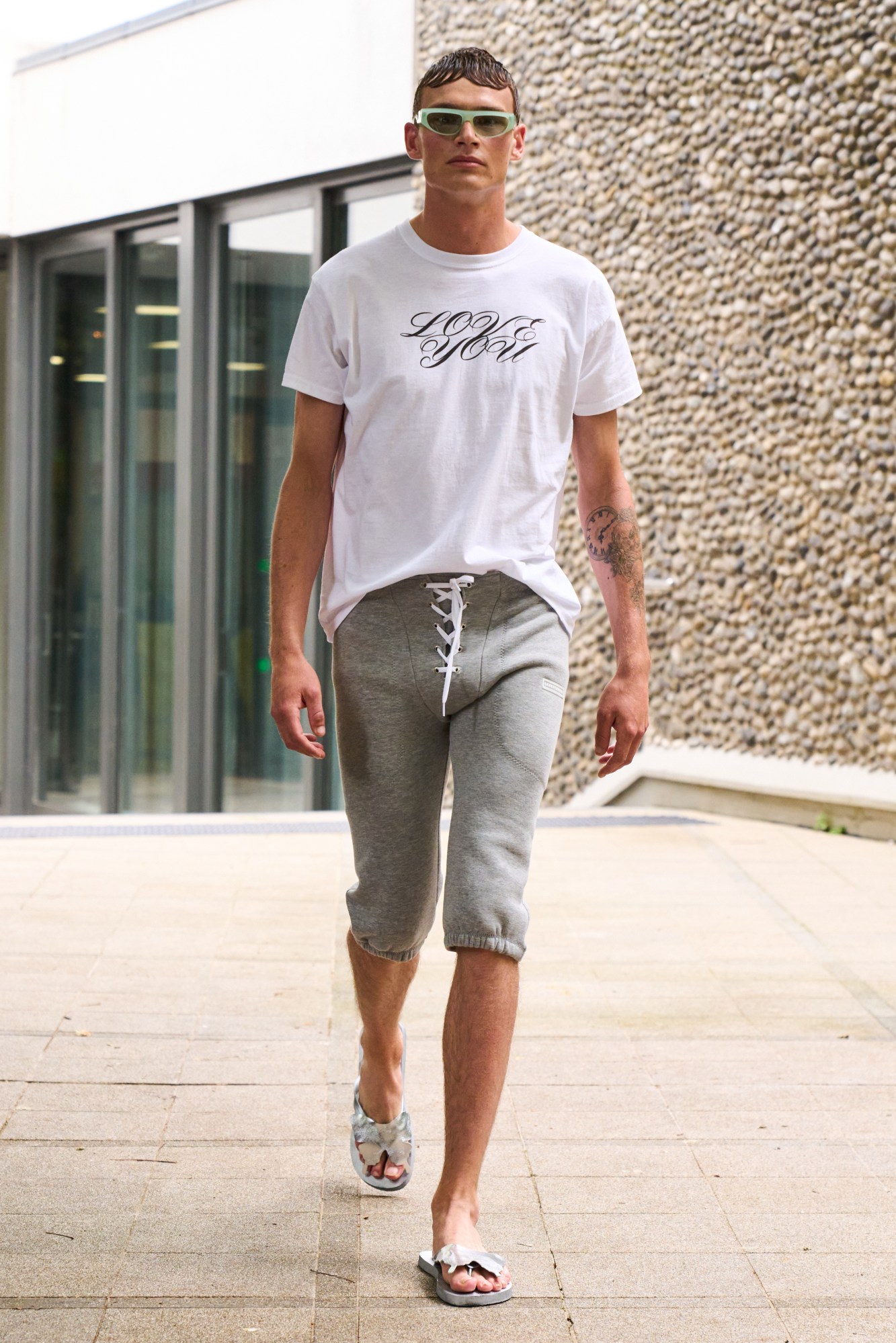 Model wearing grey sweatpants at the Lazoschmidl SS23 show