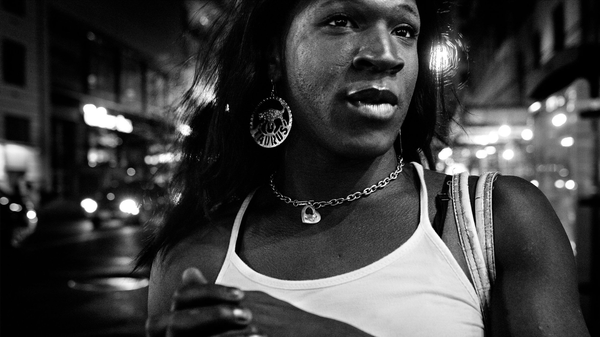 black and white close up of a black trans woman walking down a new york city street