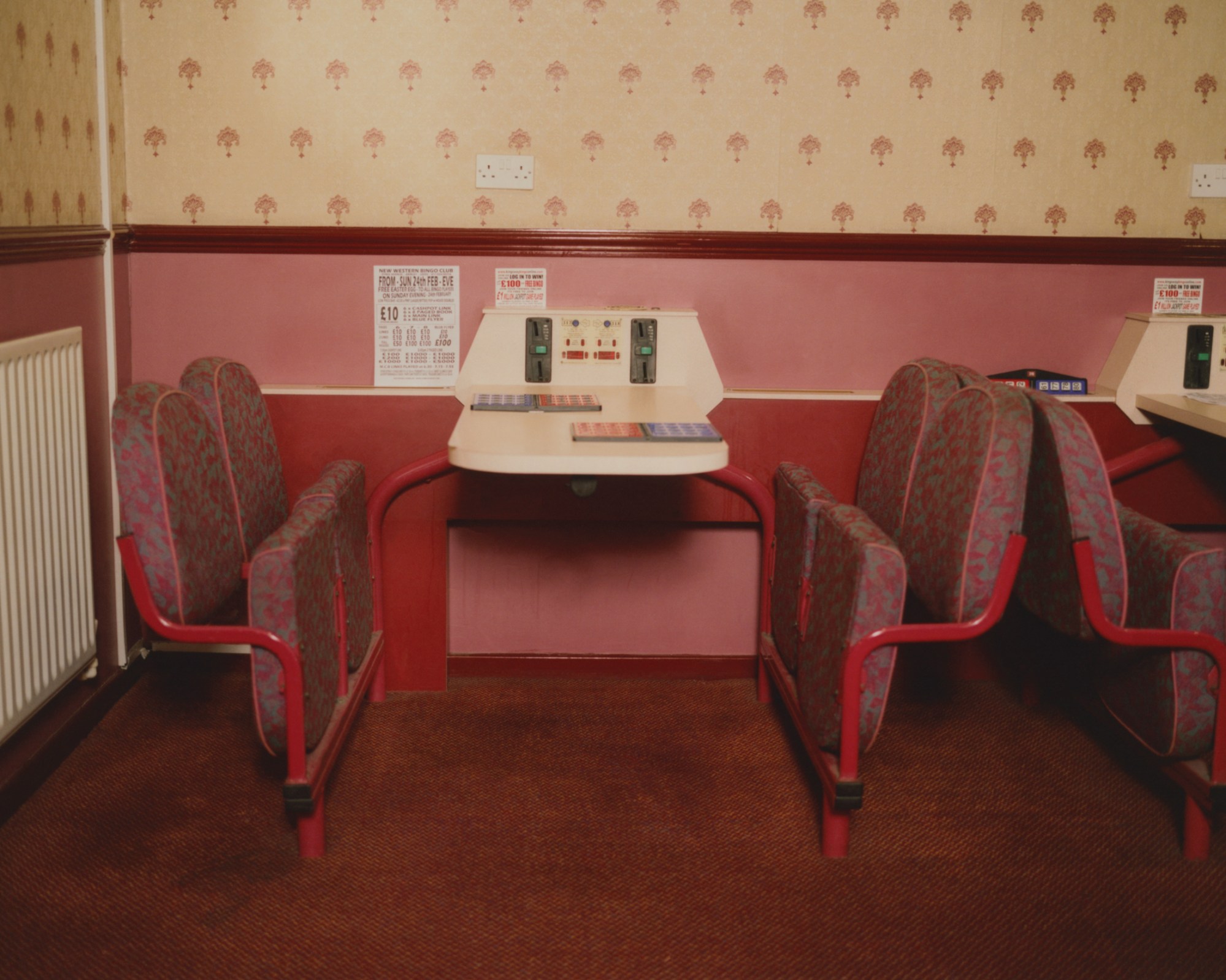 pink and red 60s folding chairs at new western bingo hall in leeds