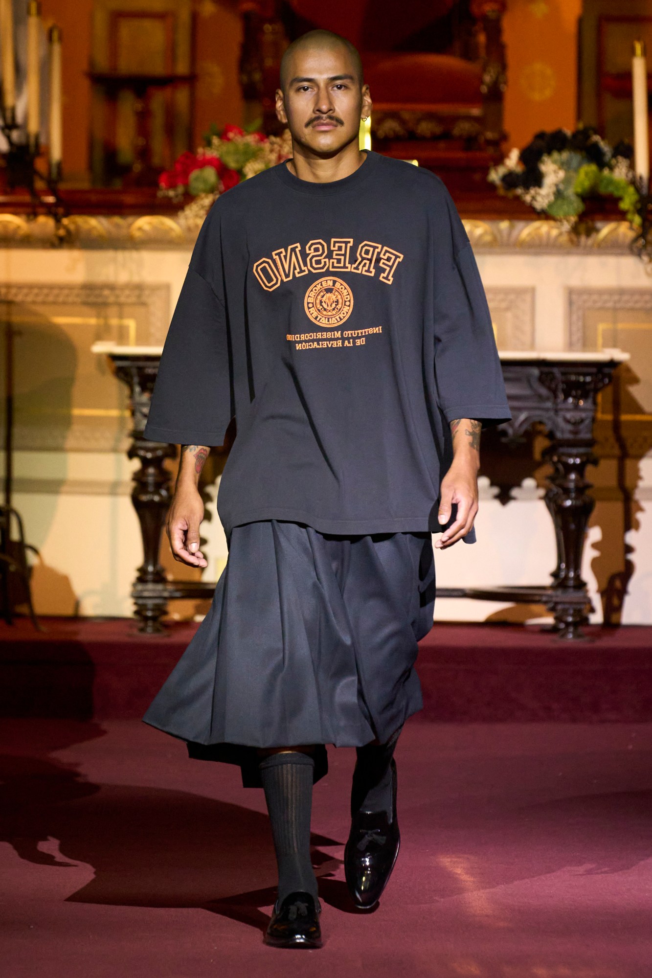 Model wearing a Willy Chavaria skirt on the runway at New York Fashion Week SS23.