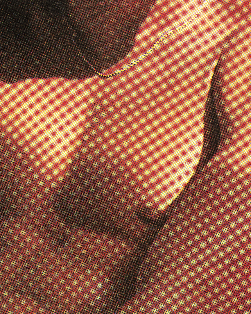 sunlight on a grainy crop of a muscly male body