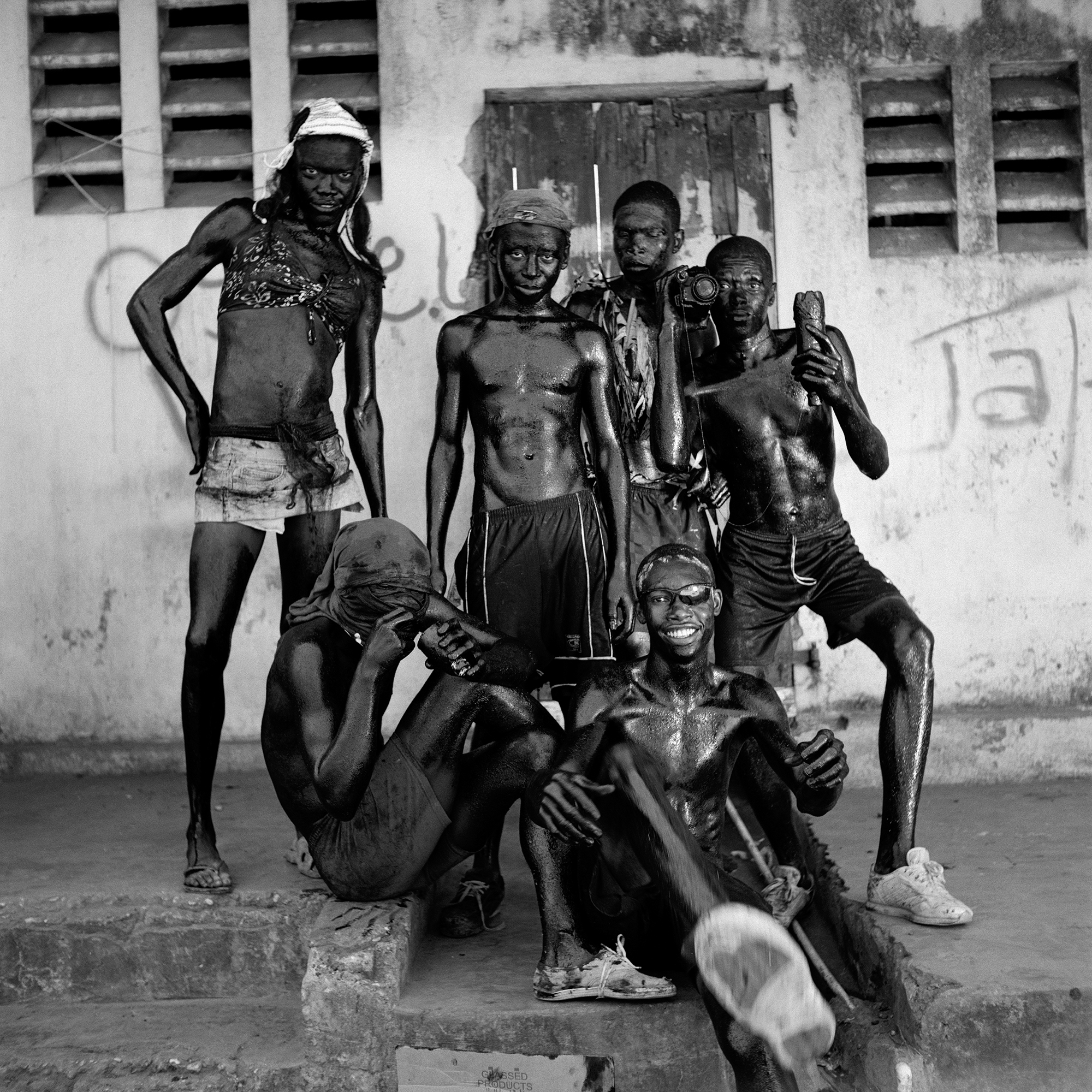 A group of young men posing for a group portrait at Haitian Kanaval.