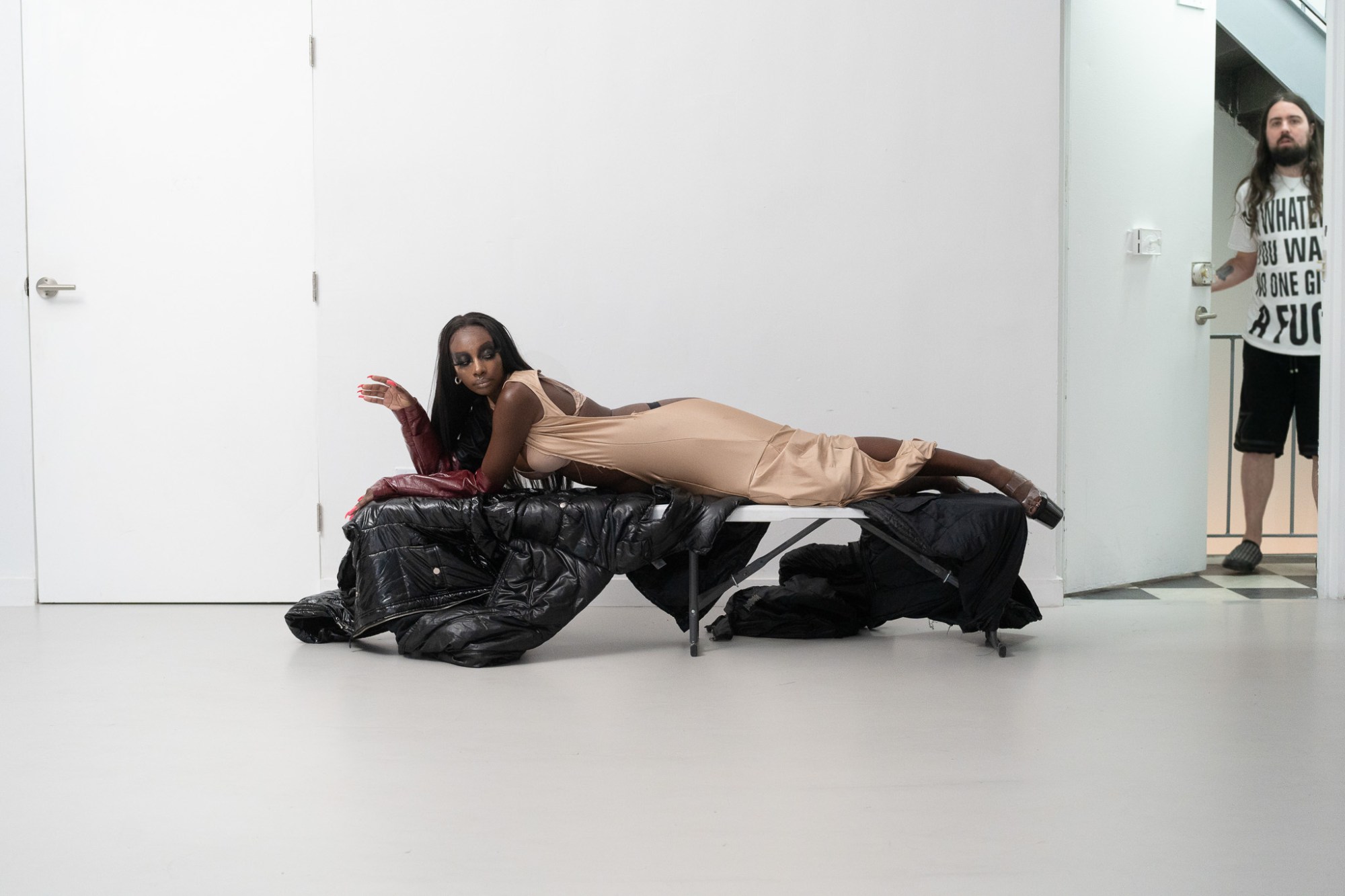 a model lying on a foldable table in anna bolina