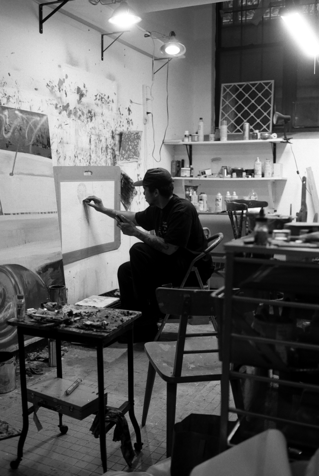 Taylor SImmons painting in his basement studio.